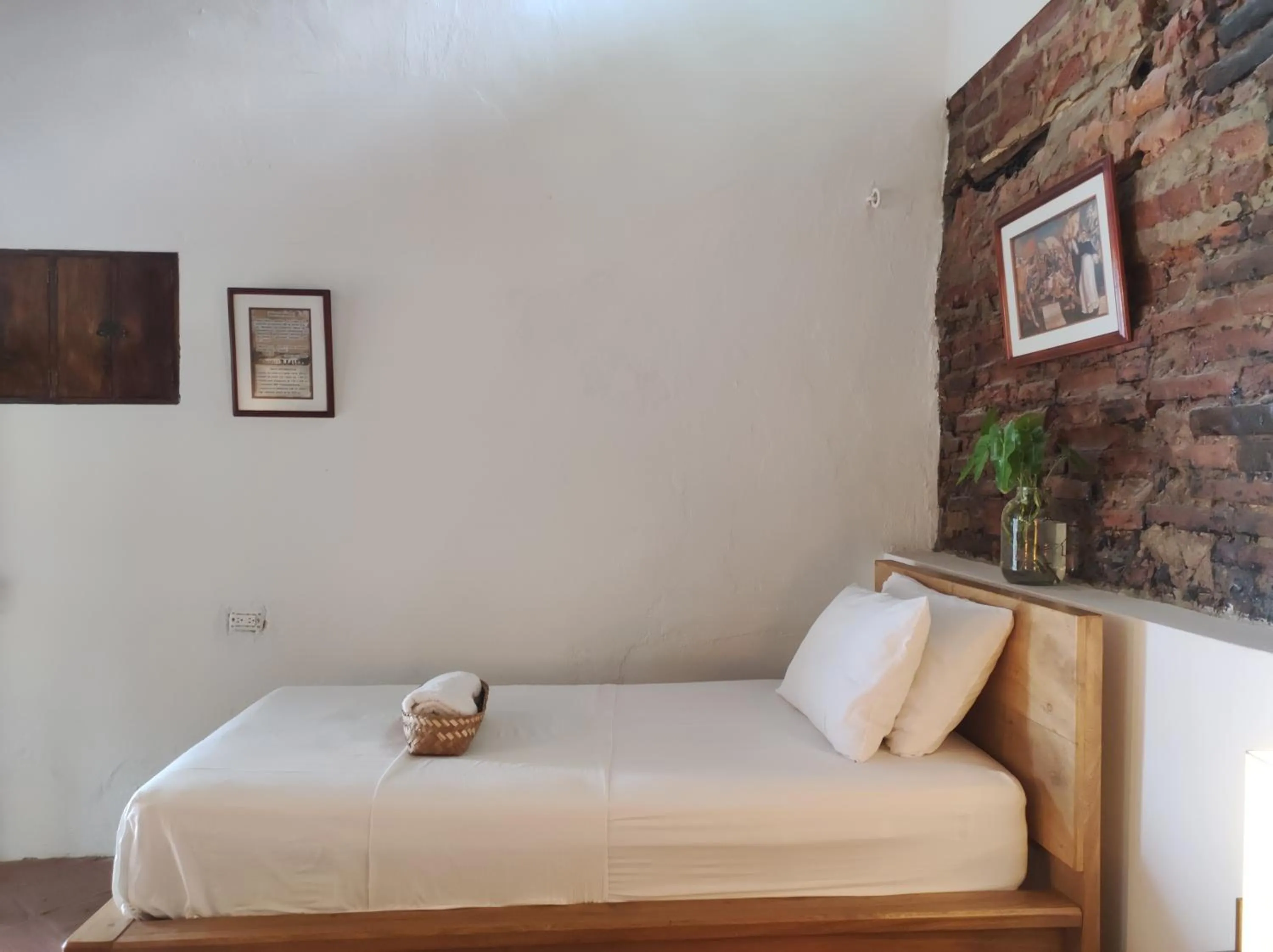 Bed in HOTEL NIETO MOMPOX, ubicado en el corazón del centro histórico, frente al rio magdalena en zona de malecón
