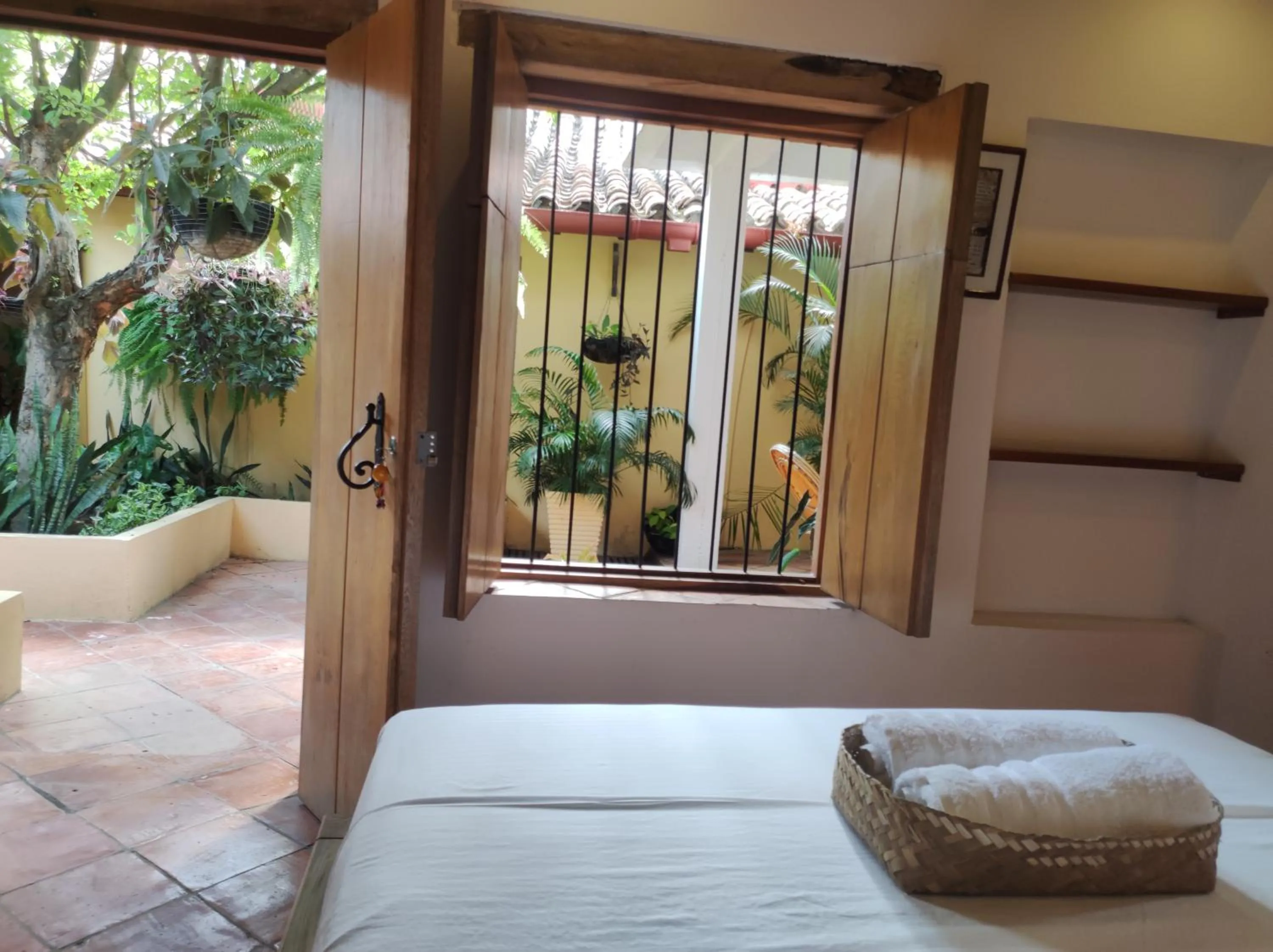 Garden view, Bed in HOTEL NIETO MOMPOX, ubicado en el corazón del centro histórico, frente al rio magdalena en zona de malecón