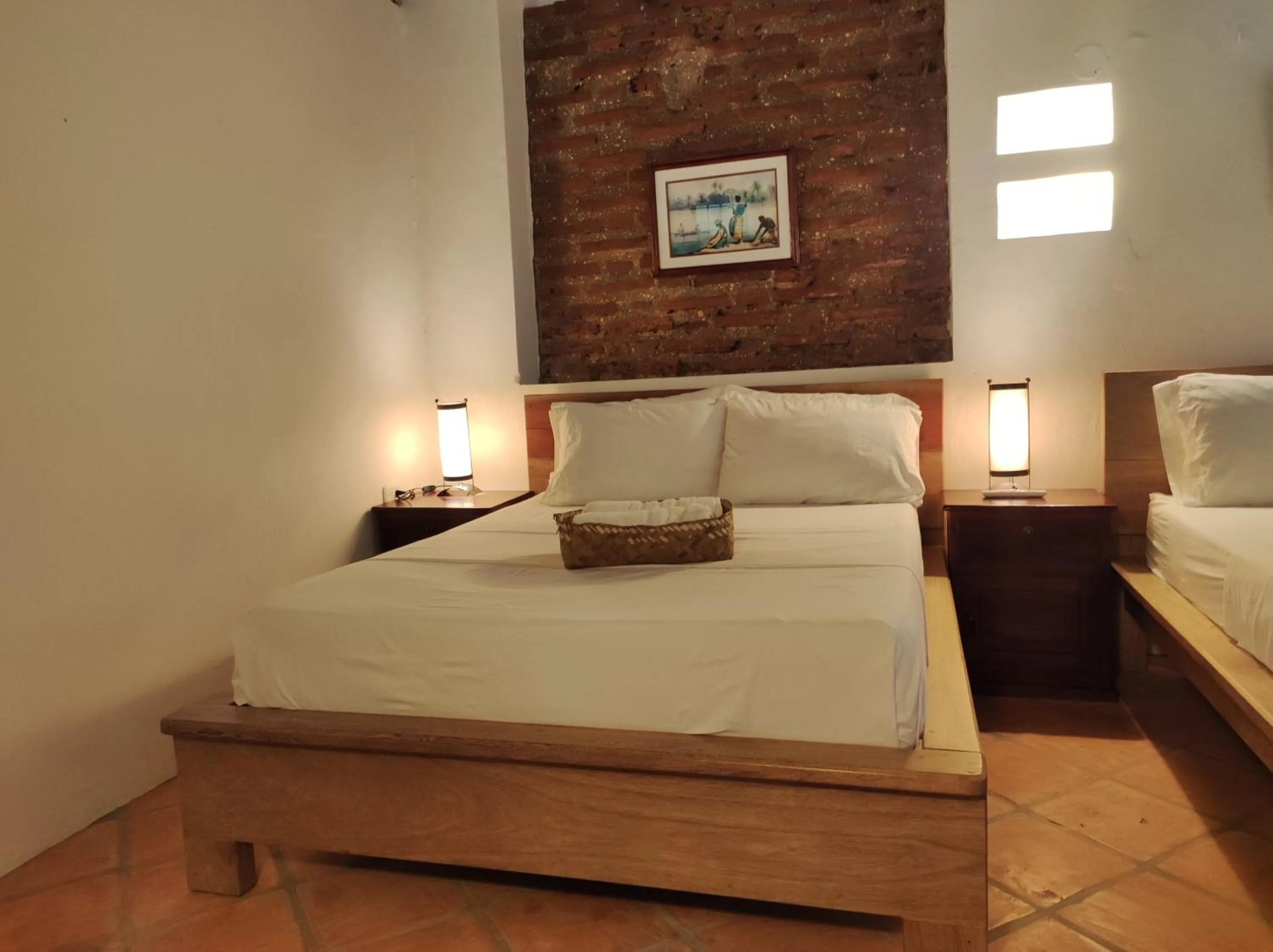 Bed in HOTEL NIETO MOMPOX, ubicado en el corazón del centro histórico, frente al rio magdalena en zona de malecón