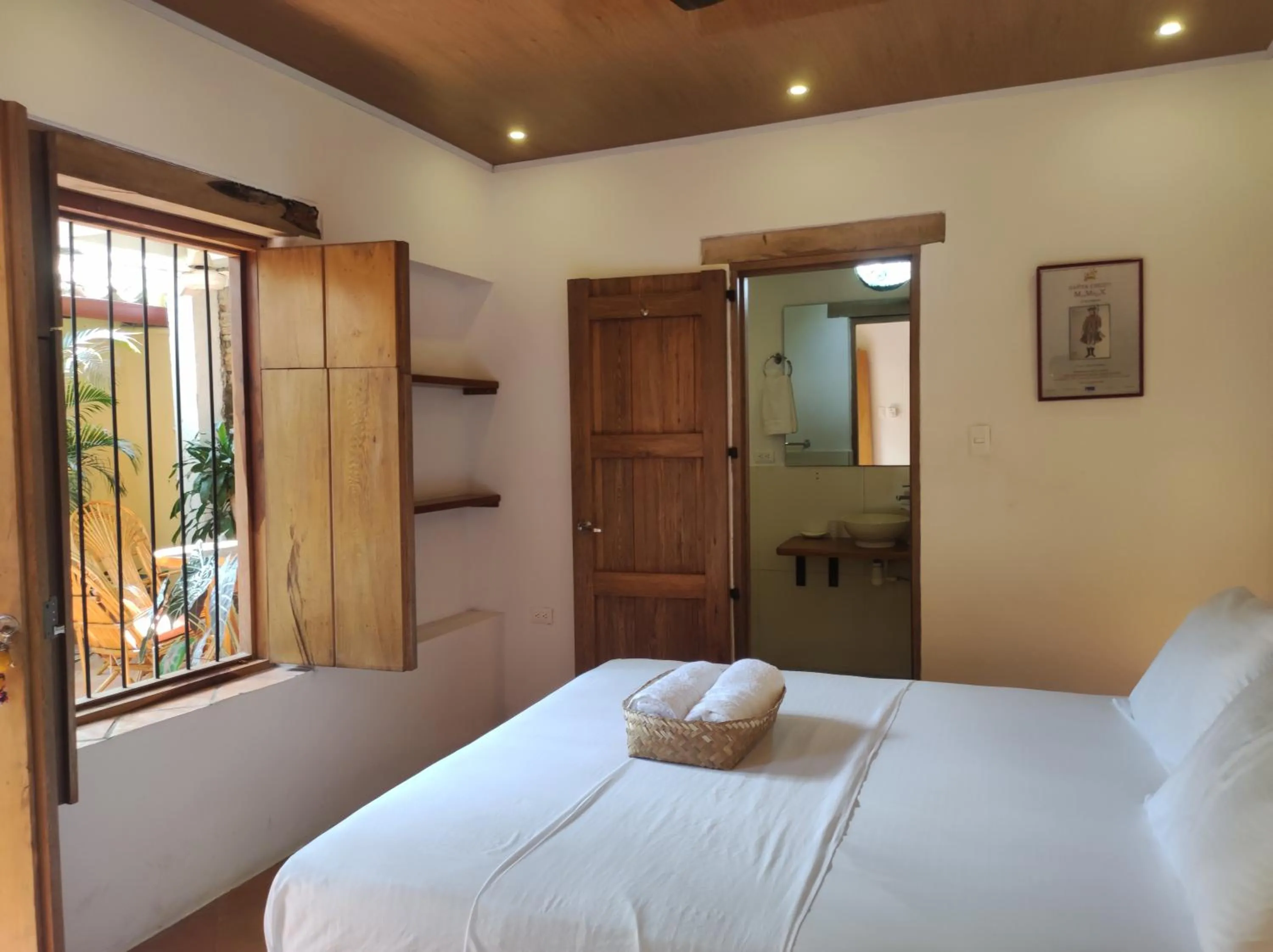 Bed in HOTEL NIETO MOMPOX, ubicado en el corazón del centro histórico, frente al rio magdalena en zona de malecón