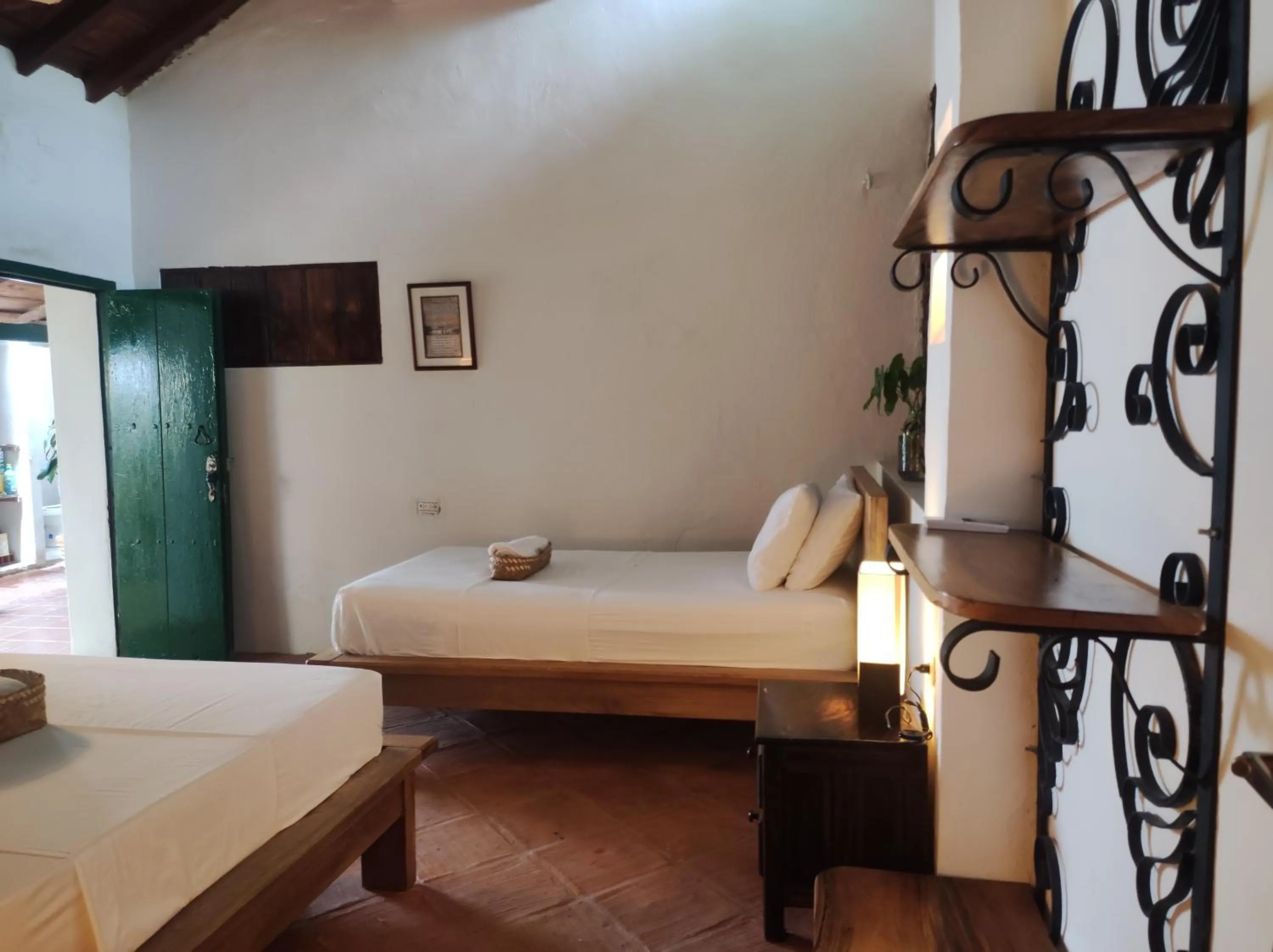 Bed in HOTEL NIETO MOMPOX, ubicado en el corazón del centro histórico, frente al rio magdalena en zona de malecón