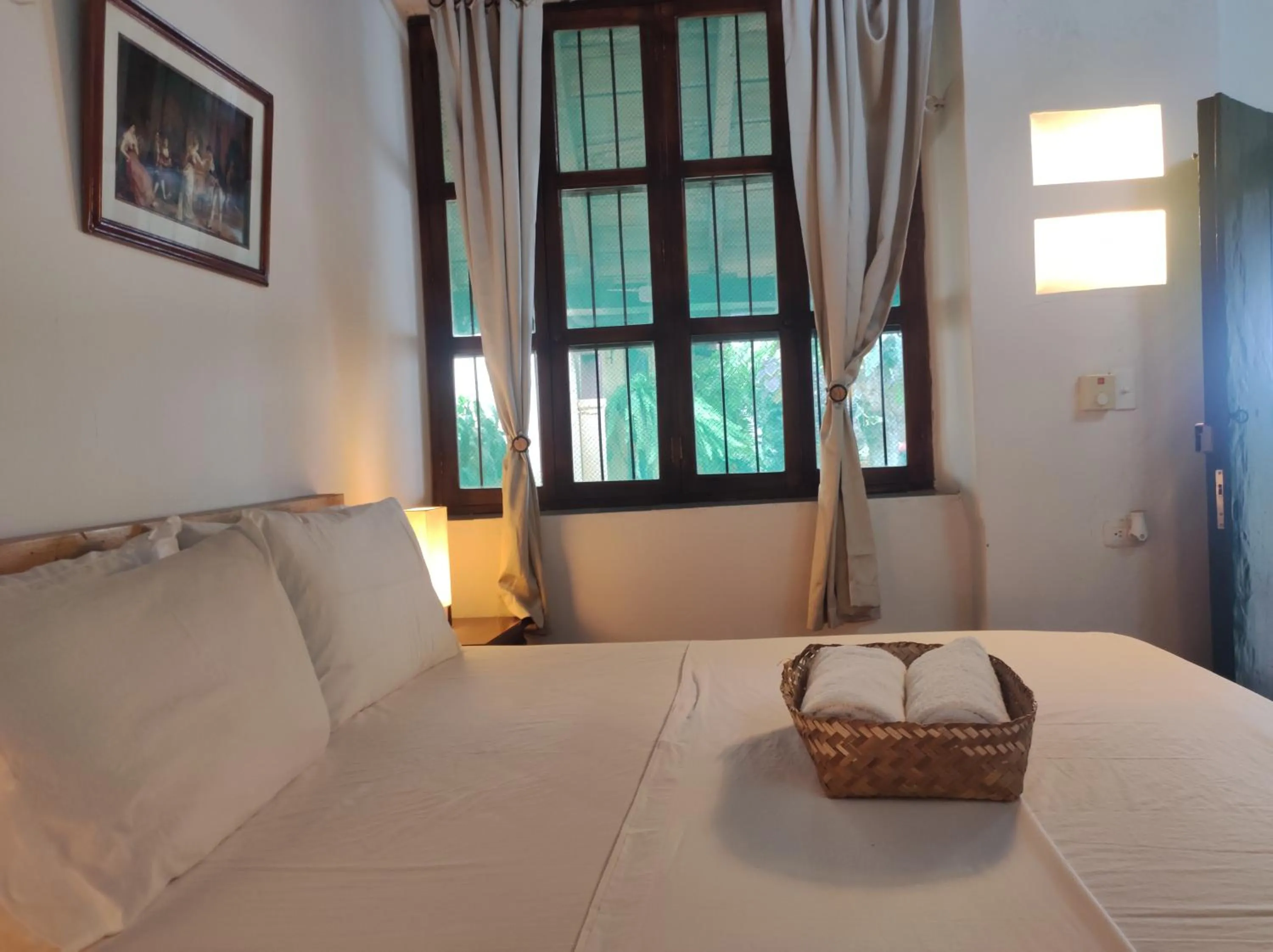 Bed in HOTEL NIETO MOMPOX, ubicado en el corazón del centro histórico, frente al rio magdalena en zona de malecón