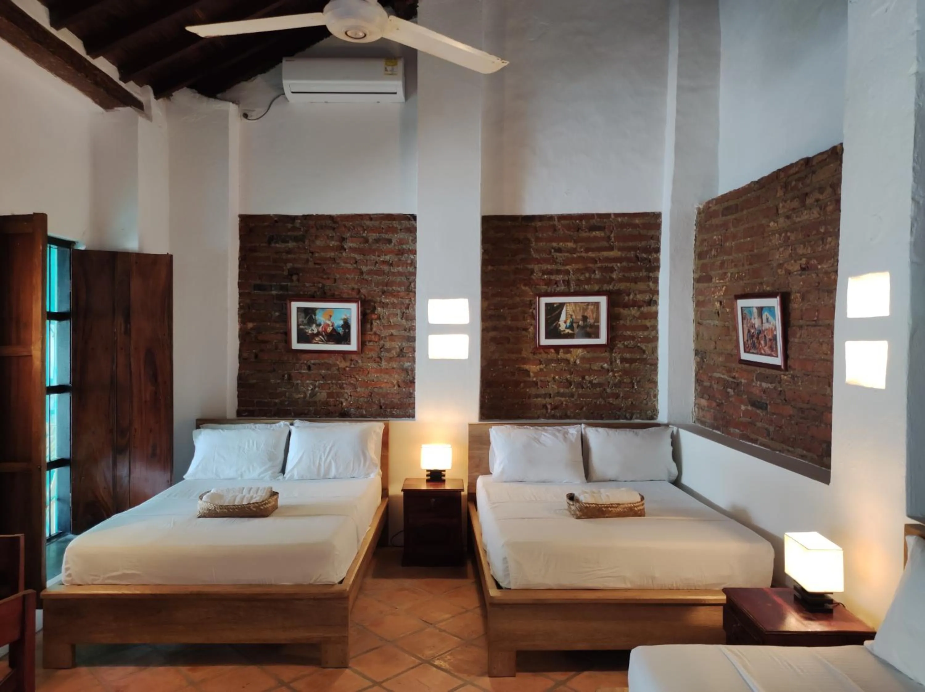Bed in HOTEL NIETO MOMPOX, ubicado en el corazón del centro histórico, frente al rio magdalena en zona de malecón