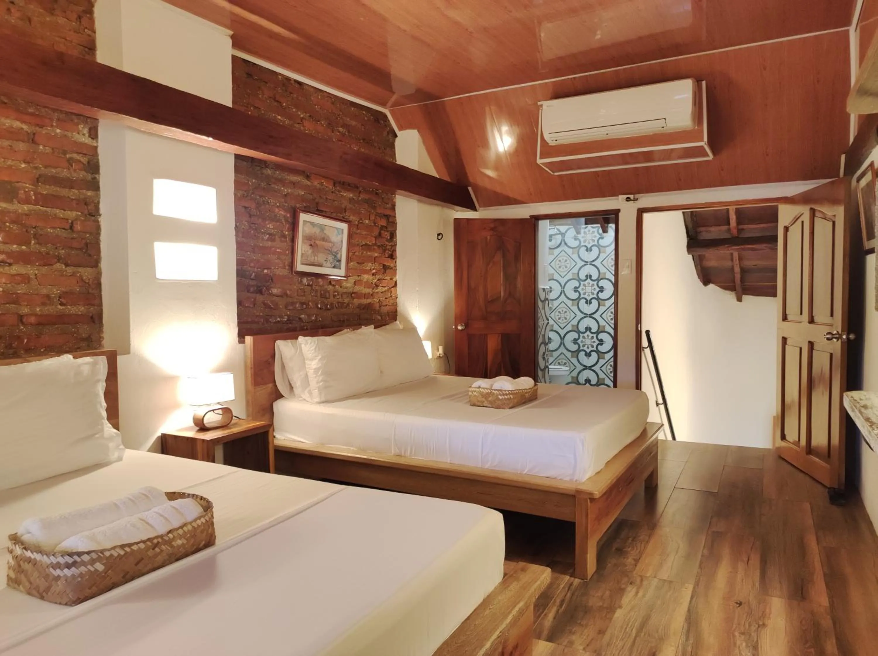Bed in HOTEL NIETO MOMPOX, ubicado en el corazón del centro histórico, frente al rio magdalena en zona de malecón