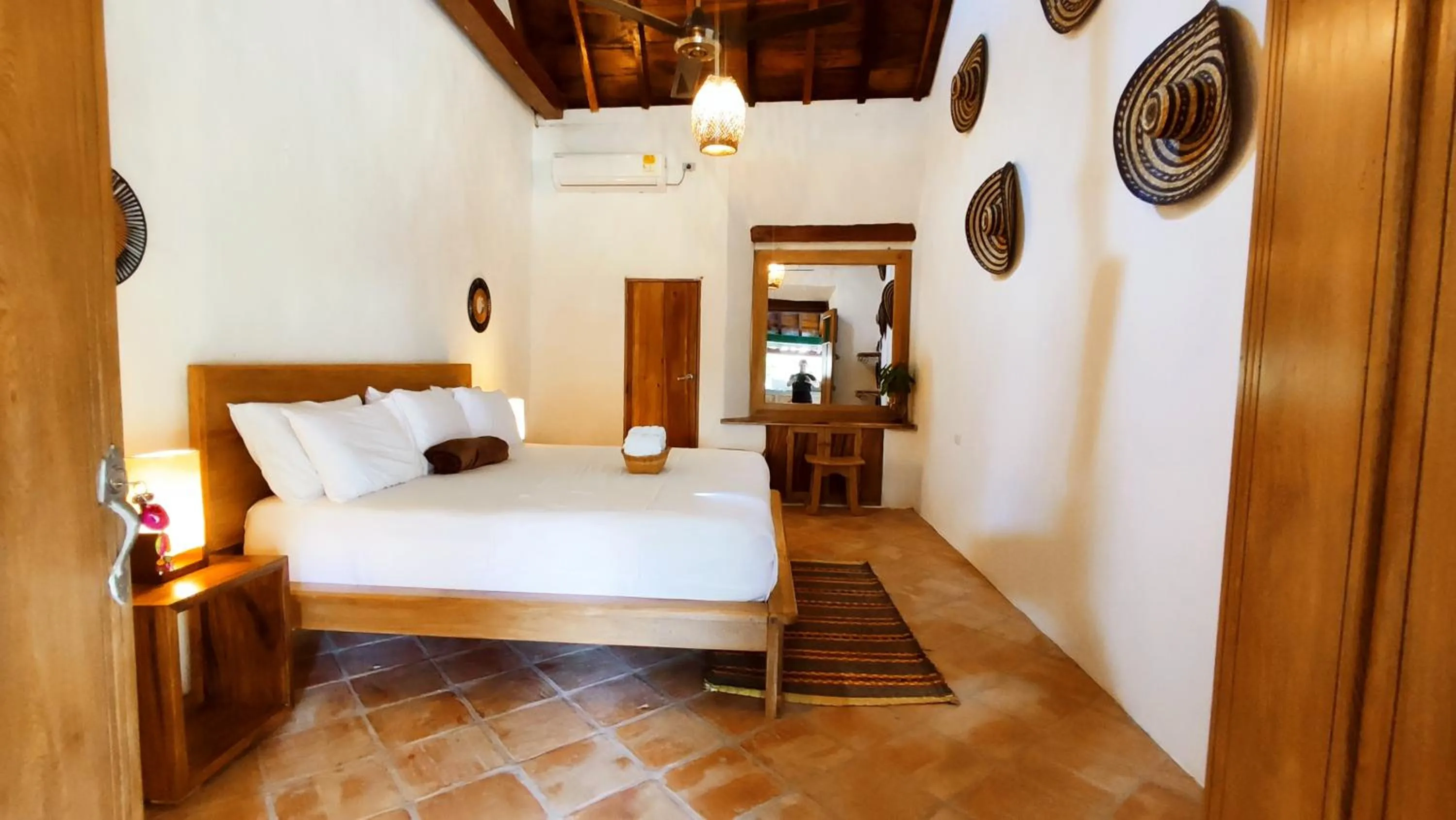 Bed in HOTEL NIETO MOMPOX, ubicado en el corazón del centro histórico, frente al rio magdalena en zona de malecón