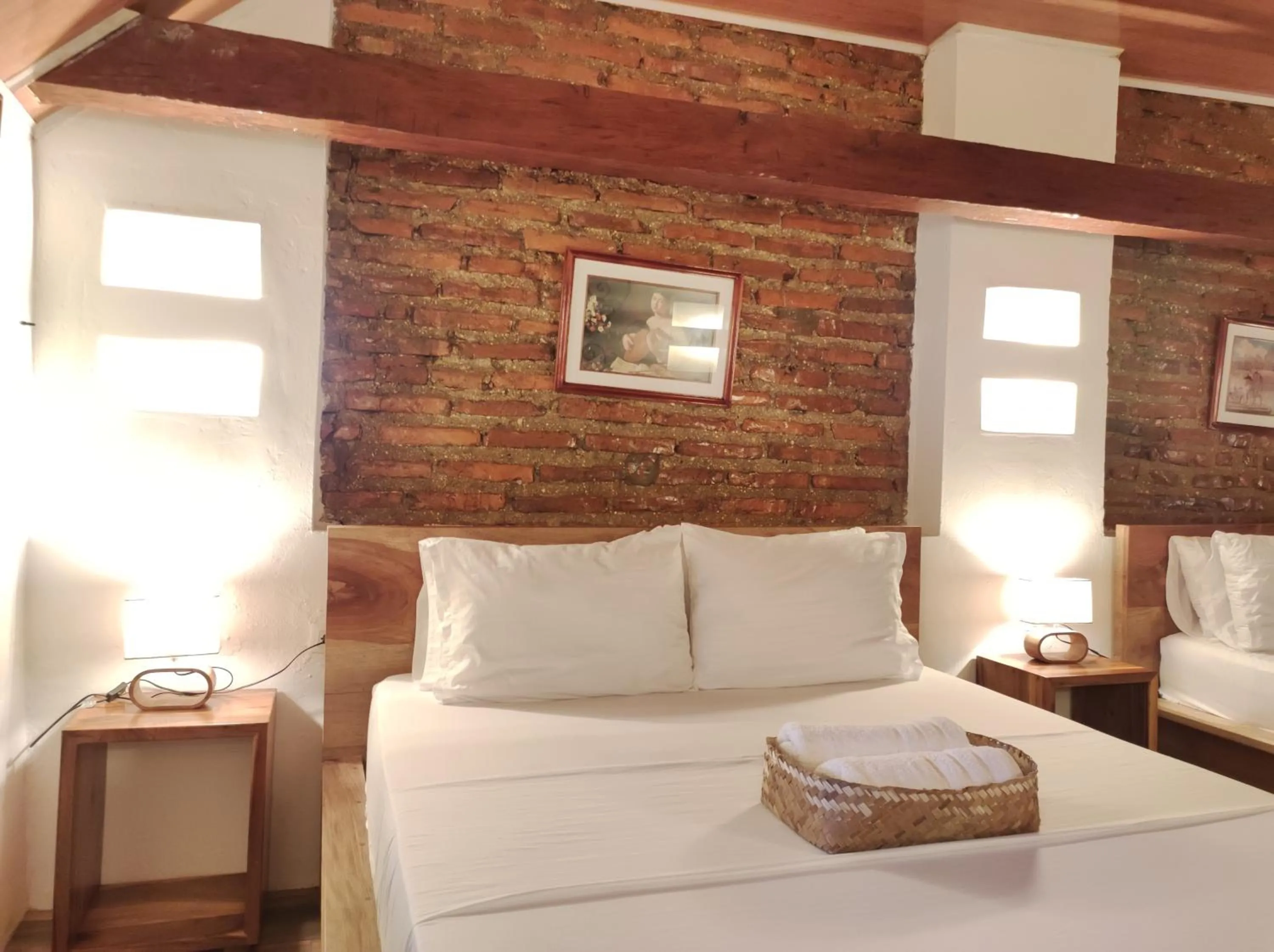 Bed in HOTEL NIETO MOMPOX, ubicado en el corazón del centro histórico, frente al rio magdalena en zona de malecón