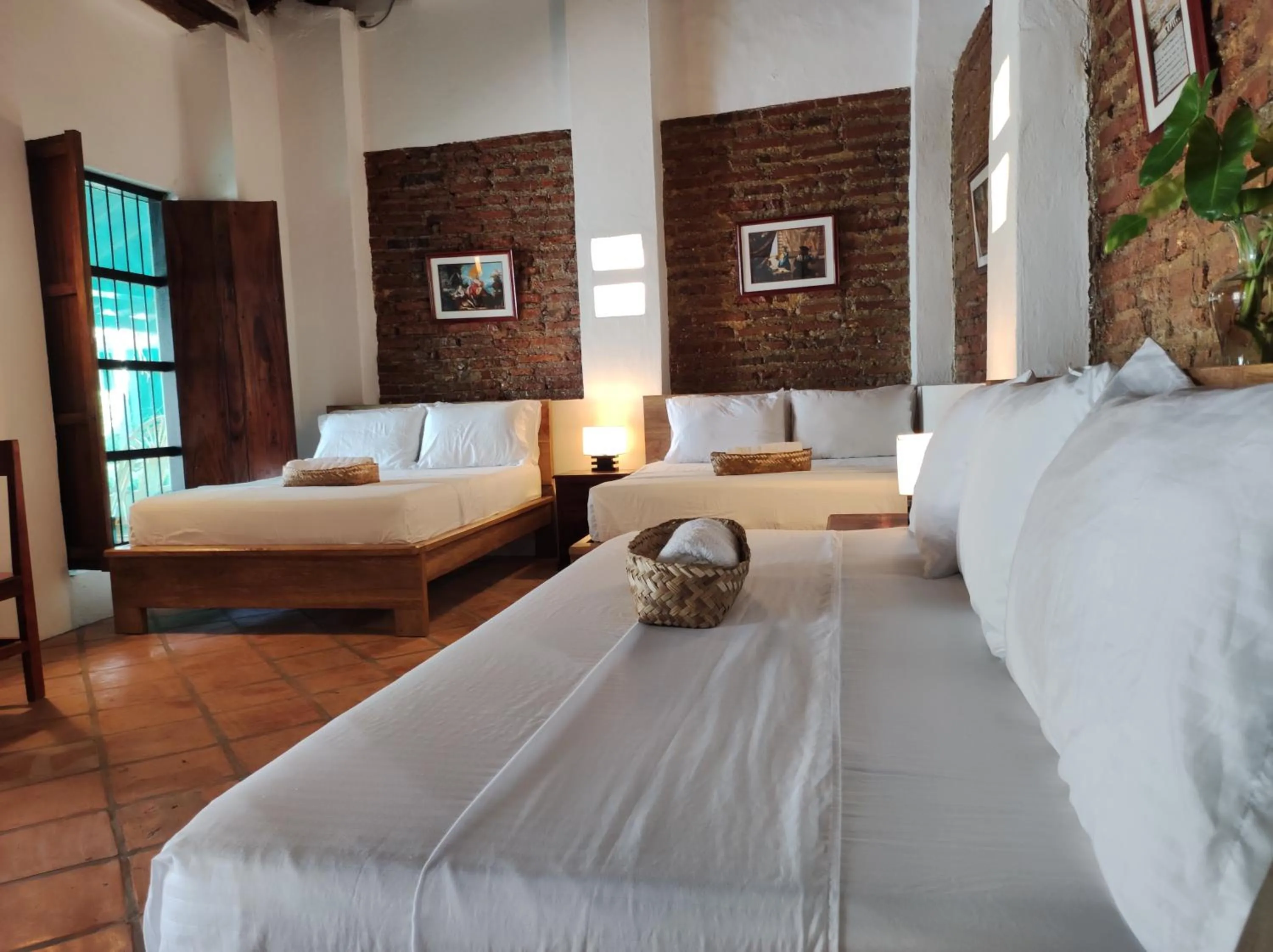 Bed in HOTEL NIETO MOMPOX, ubicado en el corazón del centro histórico, frente al rio magdalena en zona de malecón