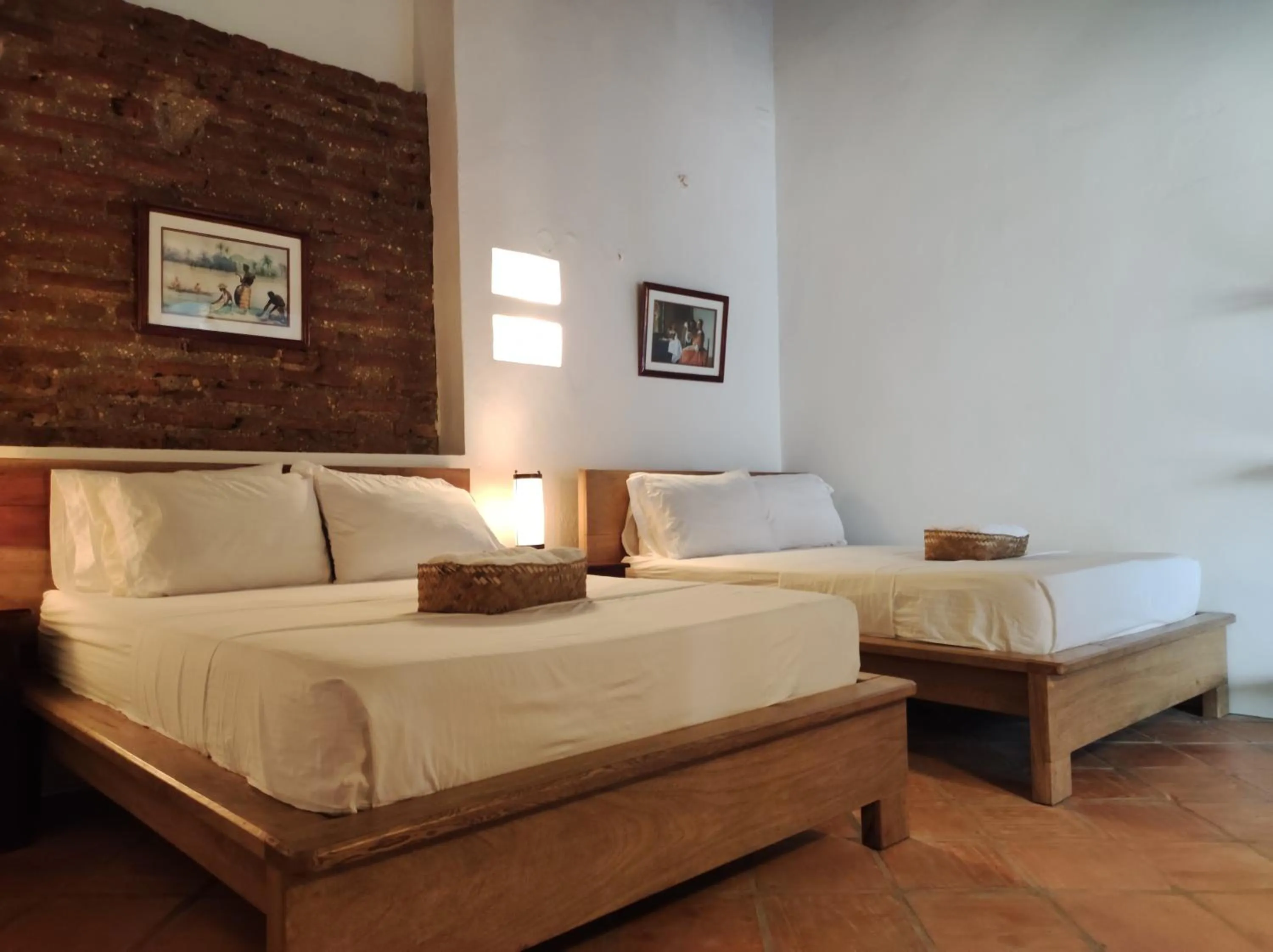 Bed in HOTEL NIETO MOMPOX, ubicado en el corazón del centro histórico, frente al rio magdalena en zona de malecón