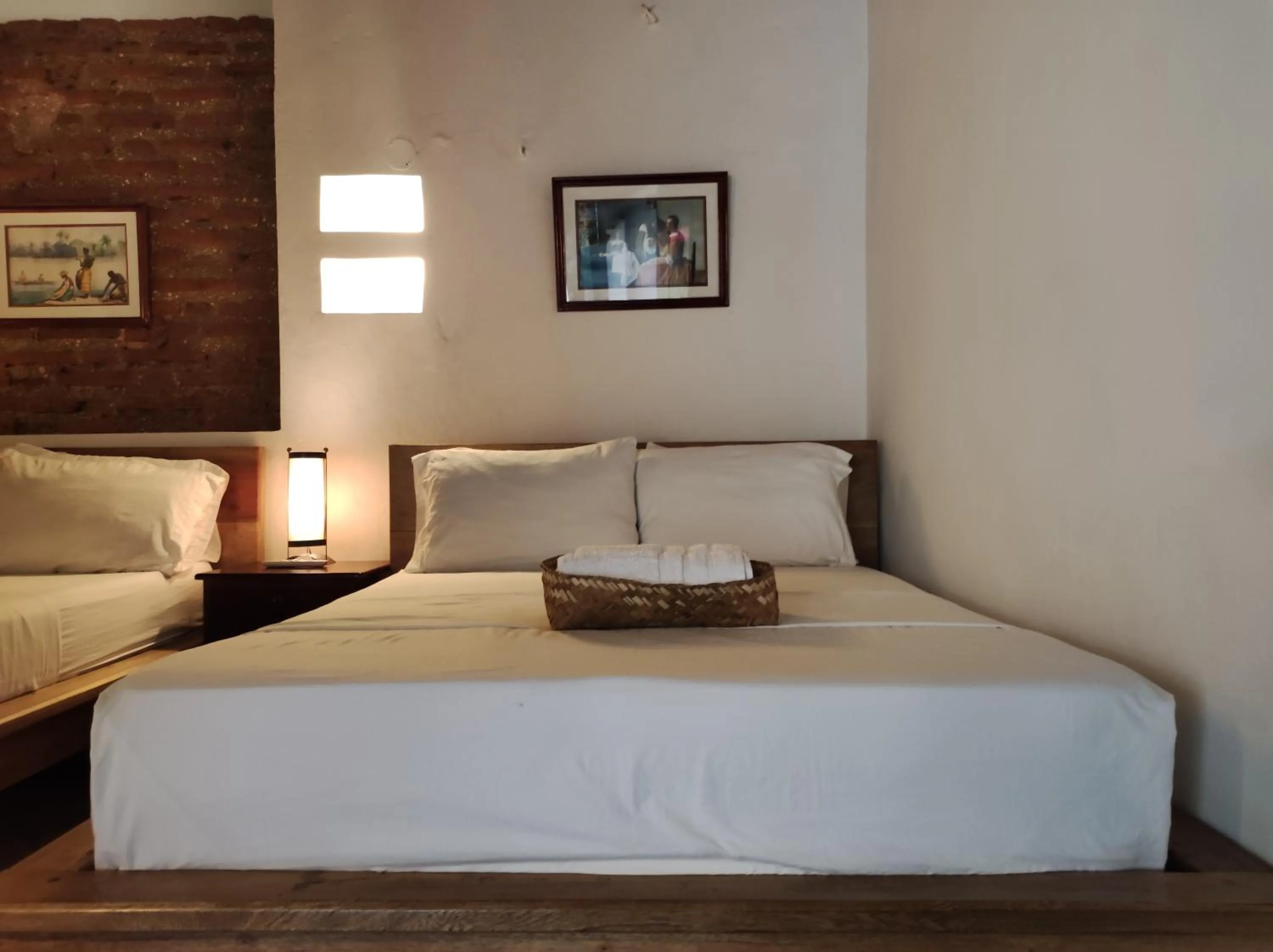 Bed in HOTEL NIETO MOMPOX, ubicado en el corazón del centro histórico, frente al rio magdalena en zona de malecón