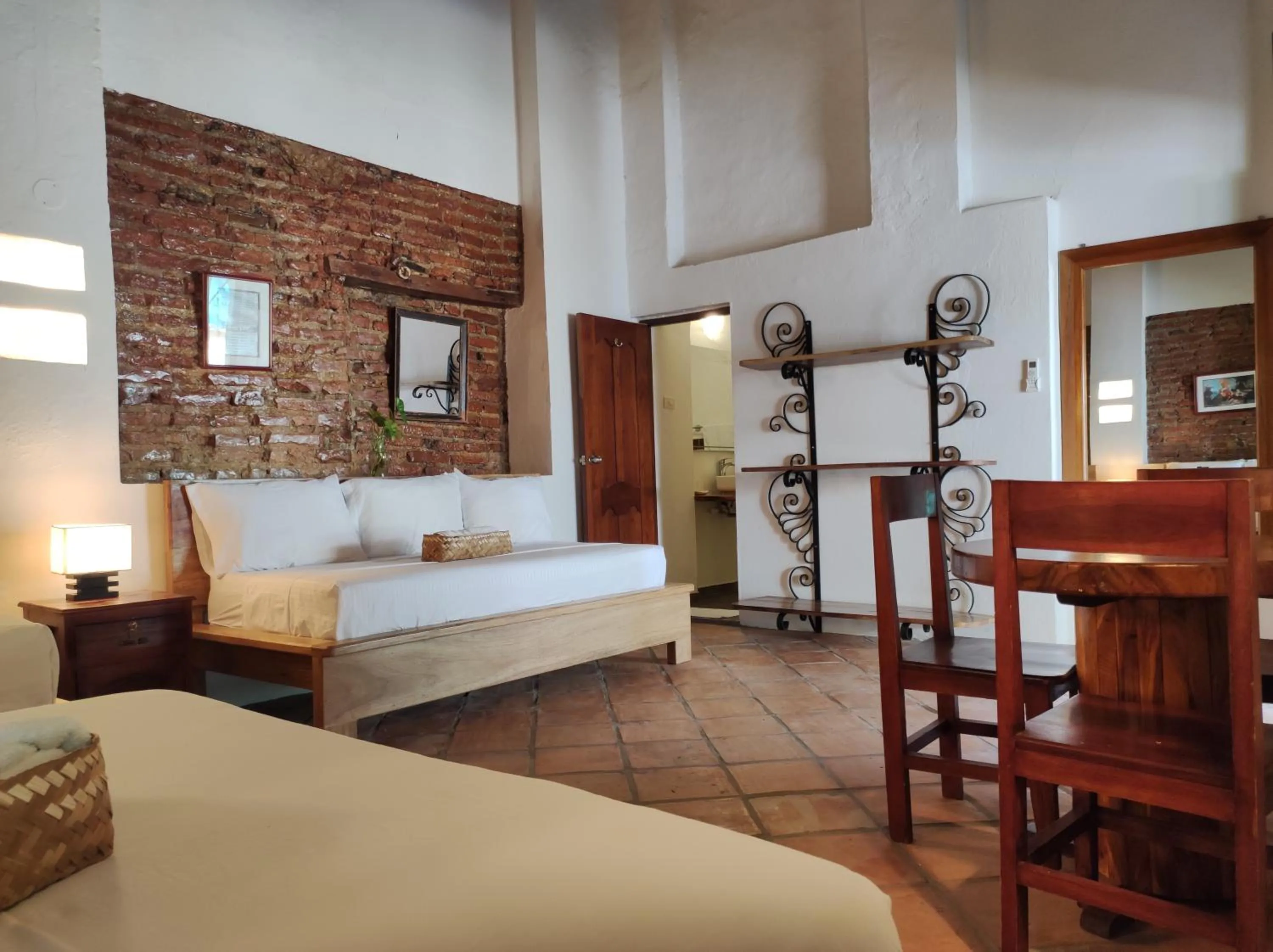 Bed in HOTEL NIETO MOMPOX, ubicado en el corazón del centro histórico, frente al rio magdalena en zona de malecón