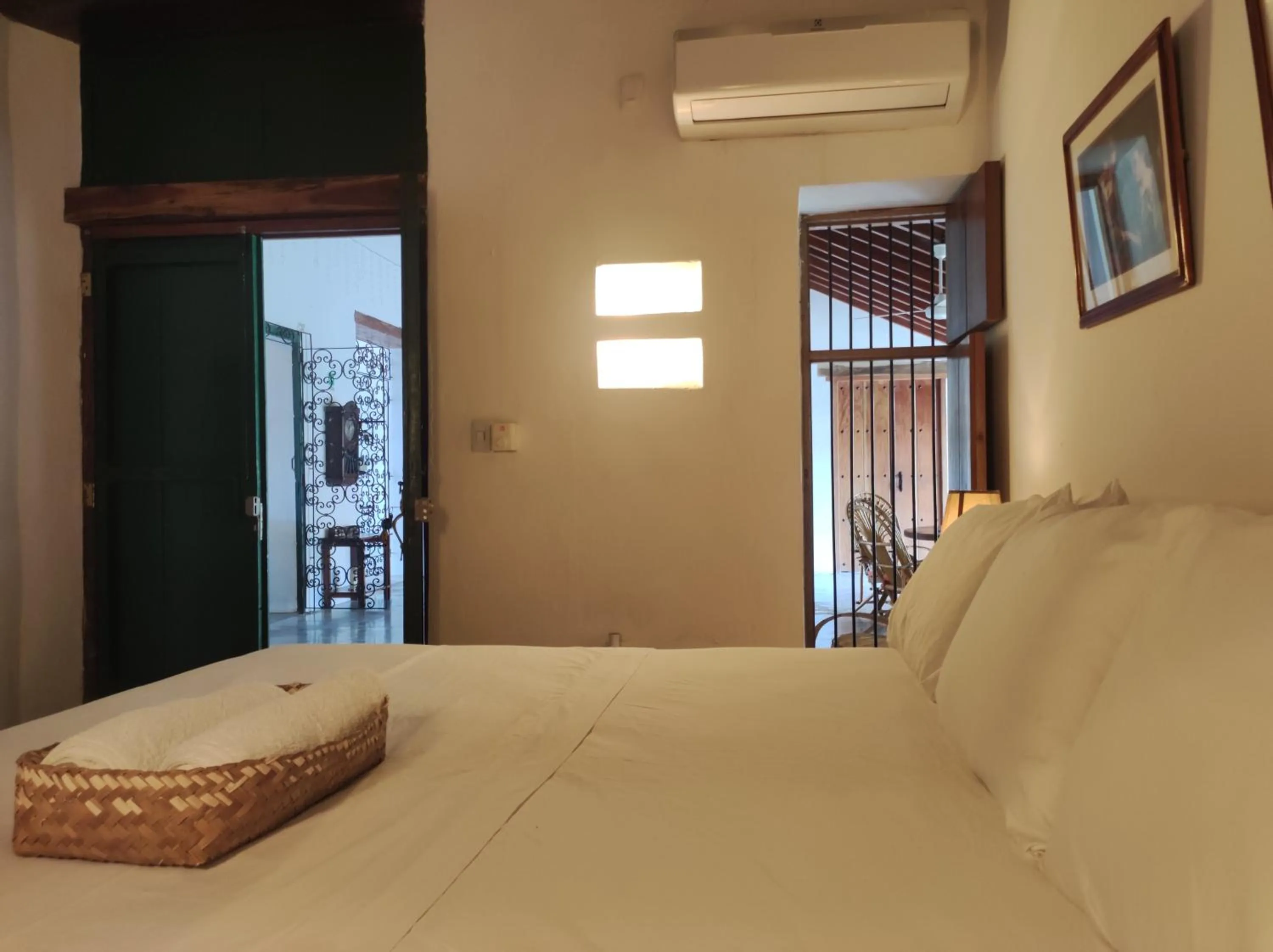 Bed in HOTEL NIETO MOMPOX, ubicado en el corazón del centro histórico, frente al rio magdalena en zona de malecón