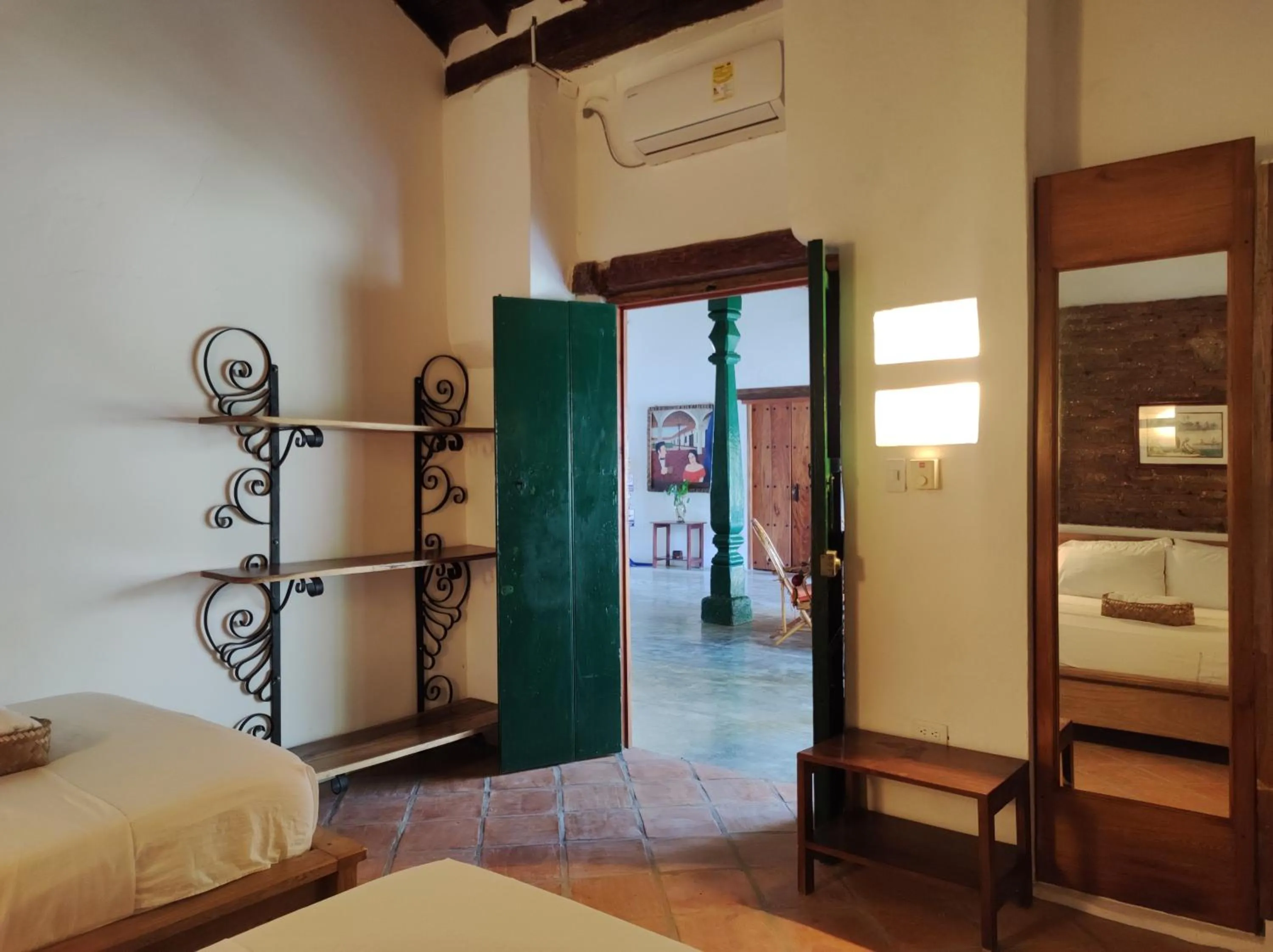 Bed in HOTEL NIETO MOMPOX, ubicado en el corazón del centro histórico, frente al rio magdalena en zona de malecón
