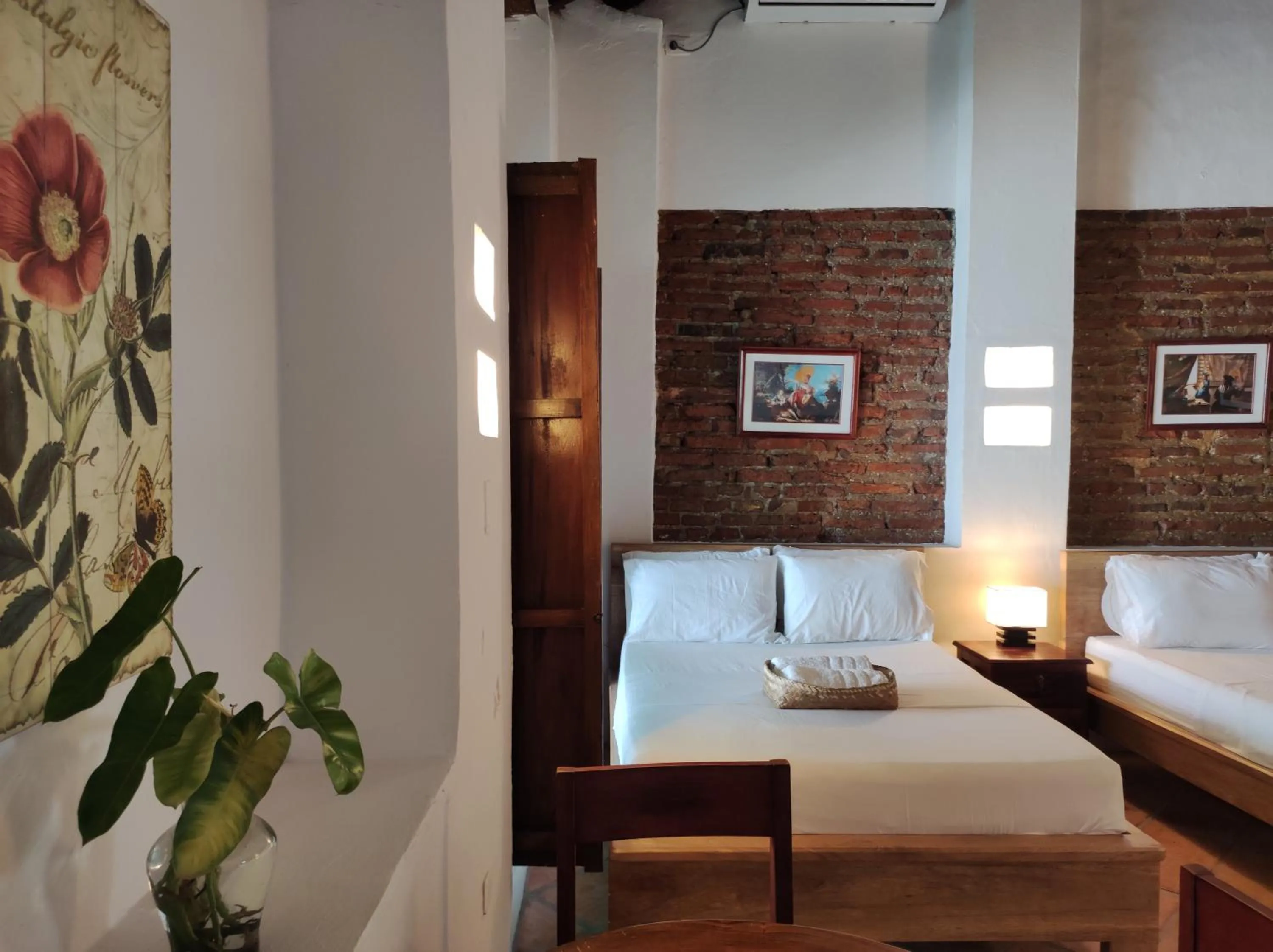 Bed in HOTEL NIETO MOMPOX, ubicado en el corazón del centro histórico, frente al rio magdalena en zona de malecón