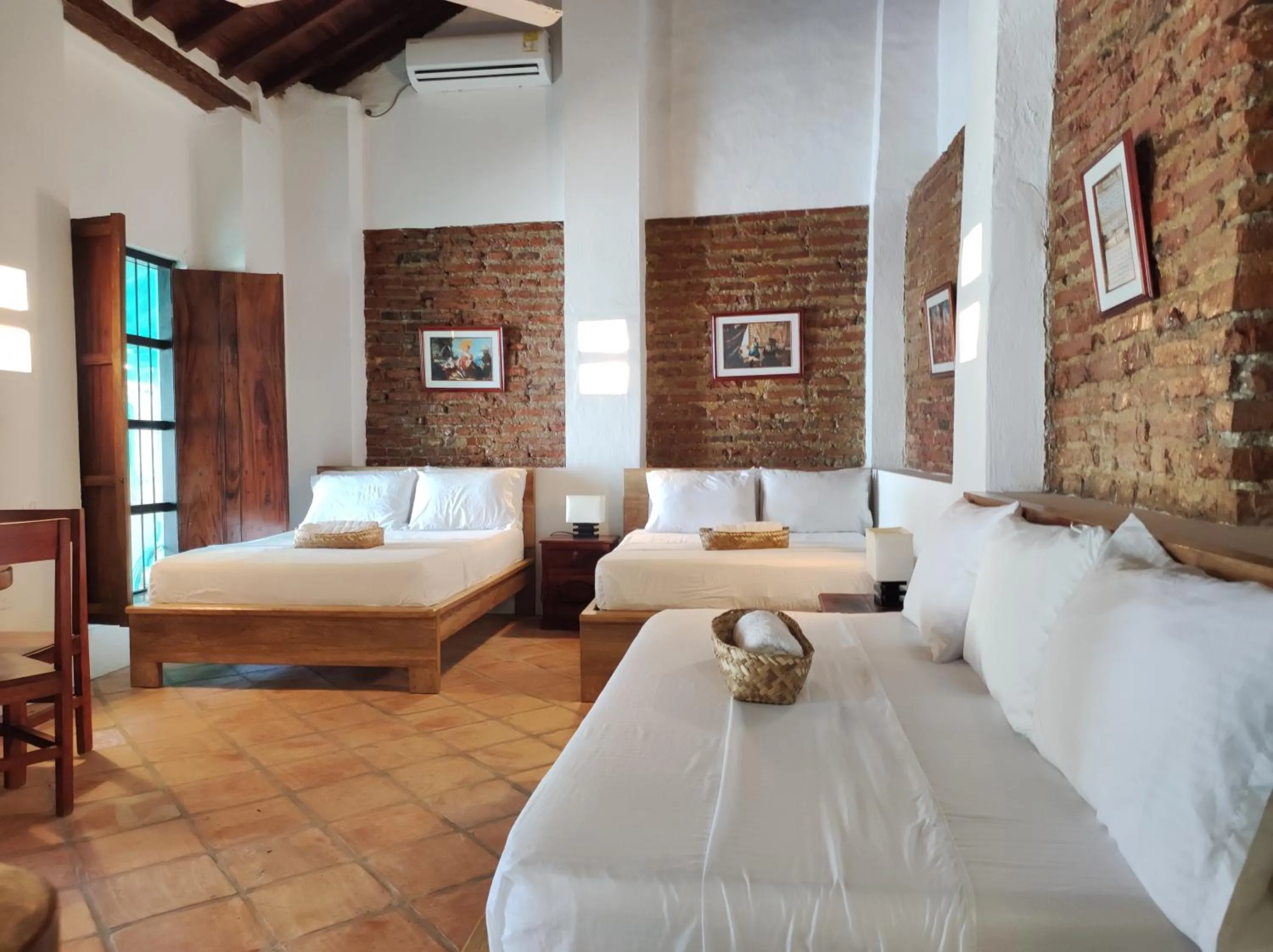 Photo of the whole room, Bed in HOTEL NIETO MOMPOX, ubicado en el corazón del centro histórico, frente al rio magdalena en zona de malecón