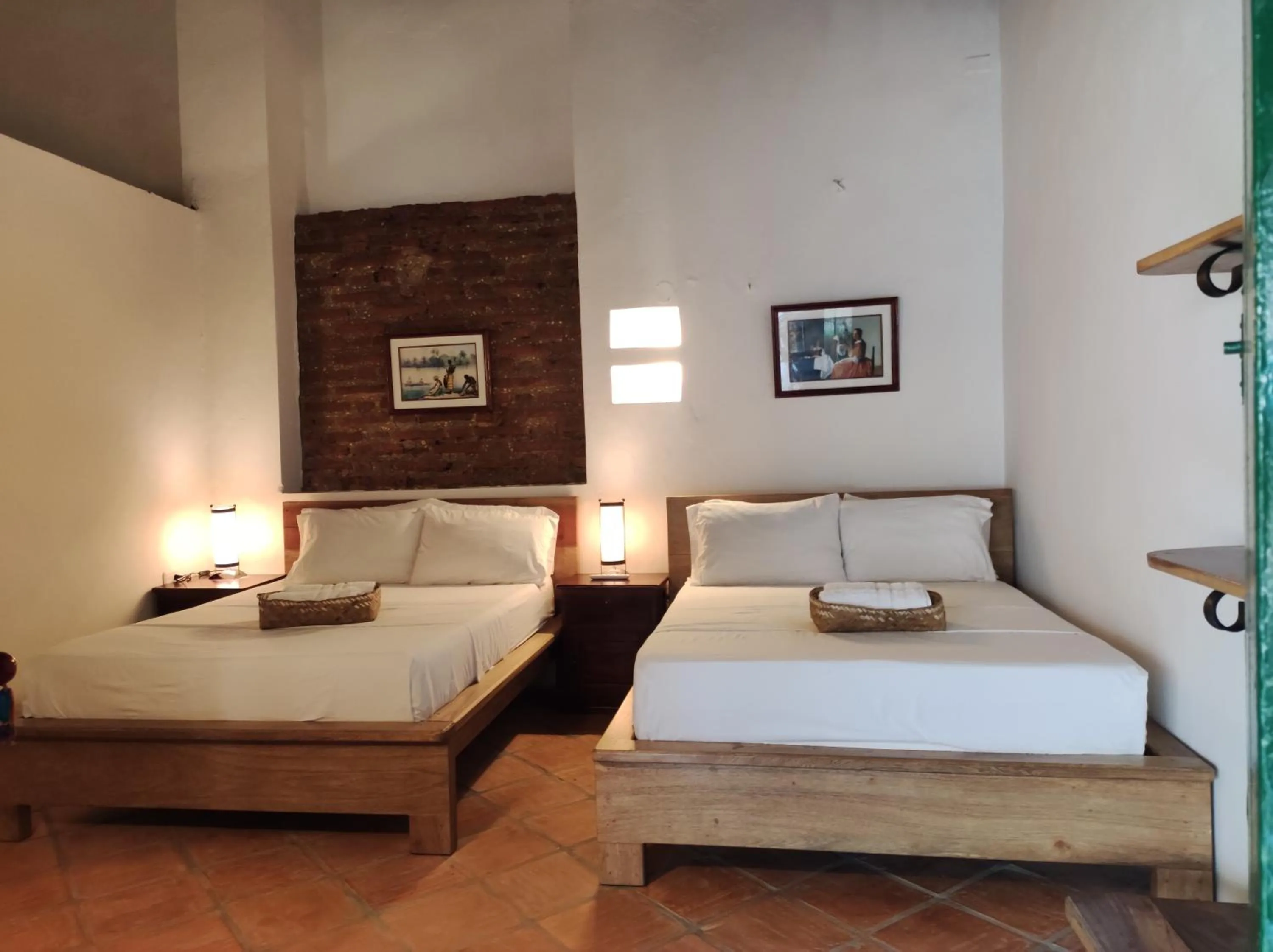 Bed in HOTEL NIETO MOMPOX, ubicado en el corazón del centro histórico, frente al rio magdalena en zona de malecón