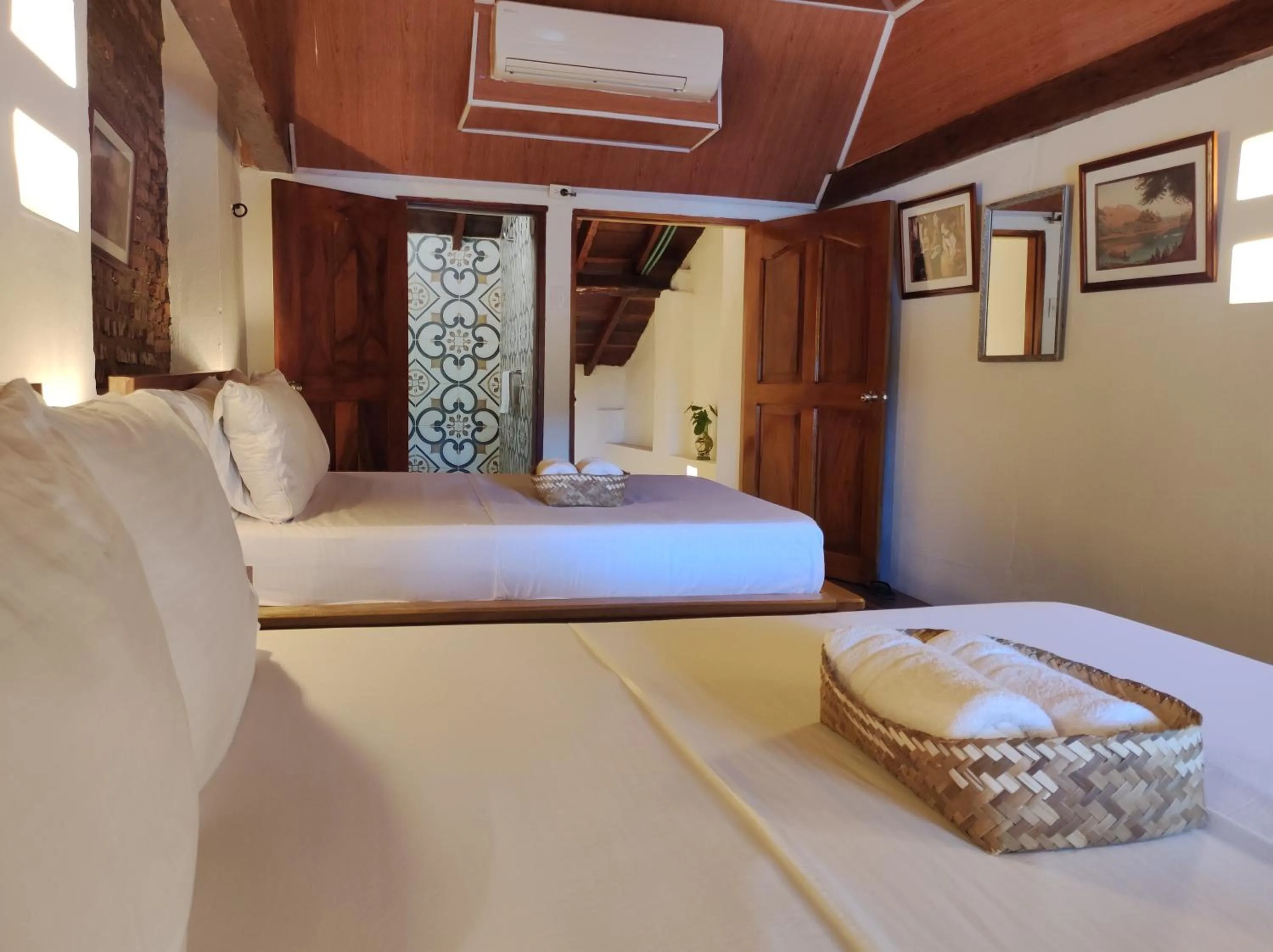 Bed in HOTEL NIETO MOMPOX, ubicado en el corazón del centro histórico, frente al rio magdalena en zona de malecón