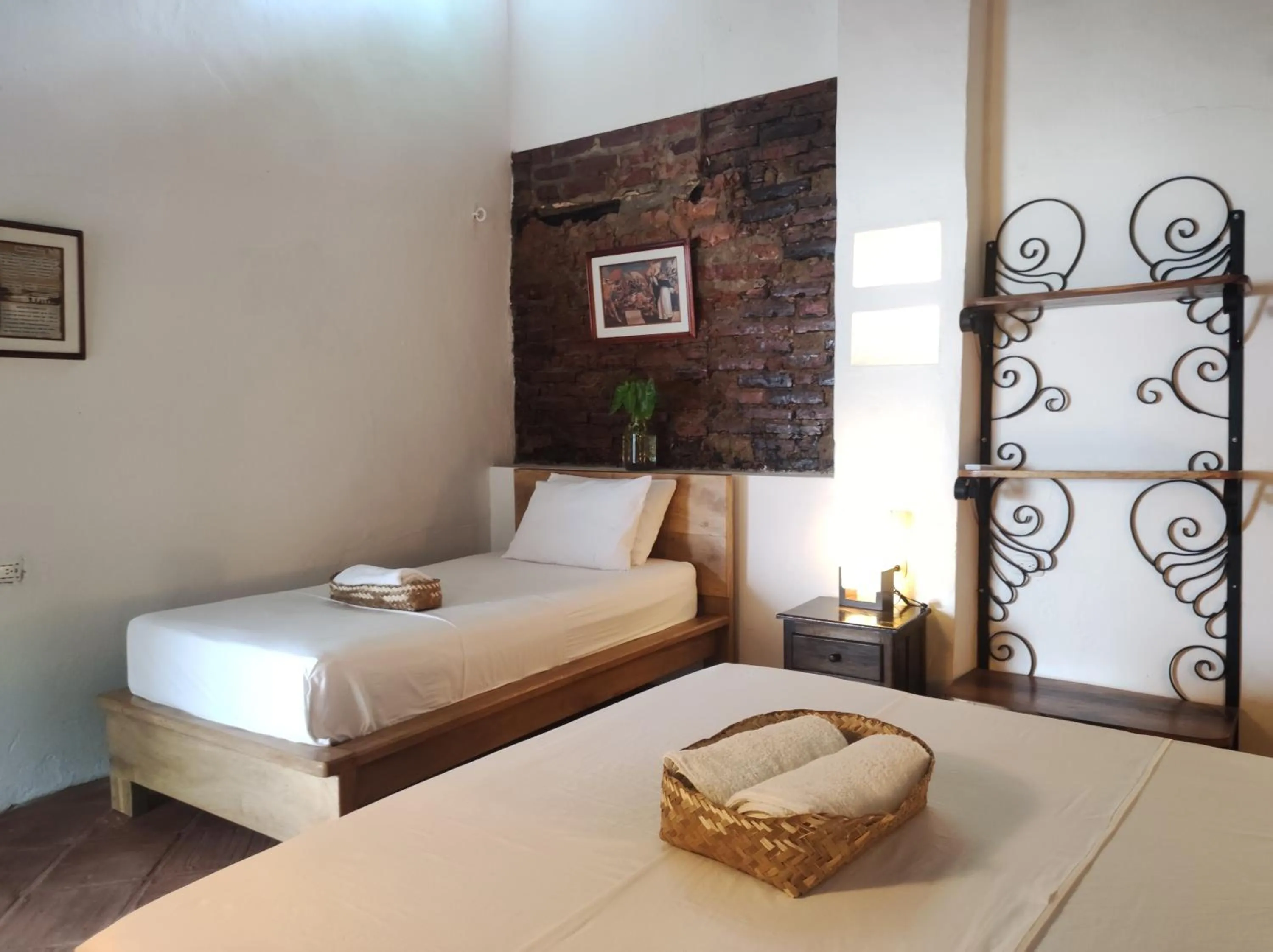 Bed in HOTEL NIETO MOMPOX, ubicado en el corazón del centro histórico, frente al rio magdalena en zona de malecón