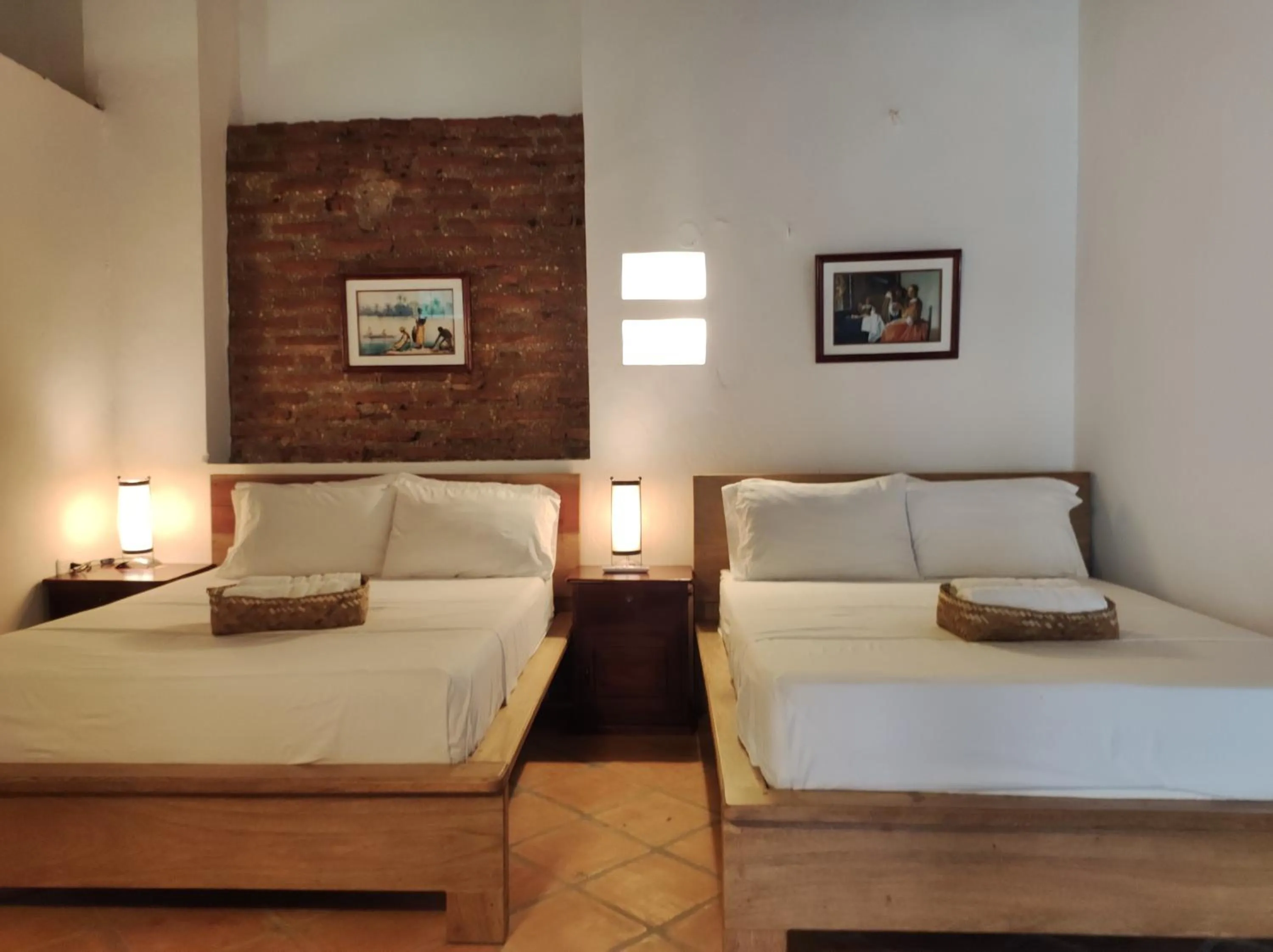 Bed in HOTEL NIETO MOMPOX, ubicado en el corazón del centro histórico, frente al rio magdalena en zona de malecón