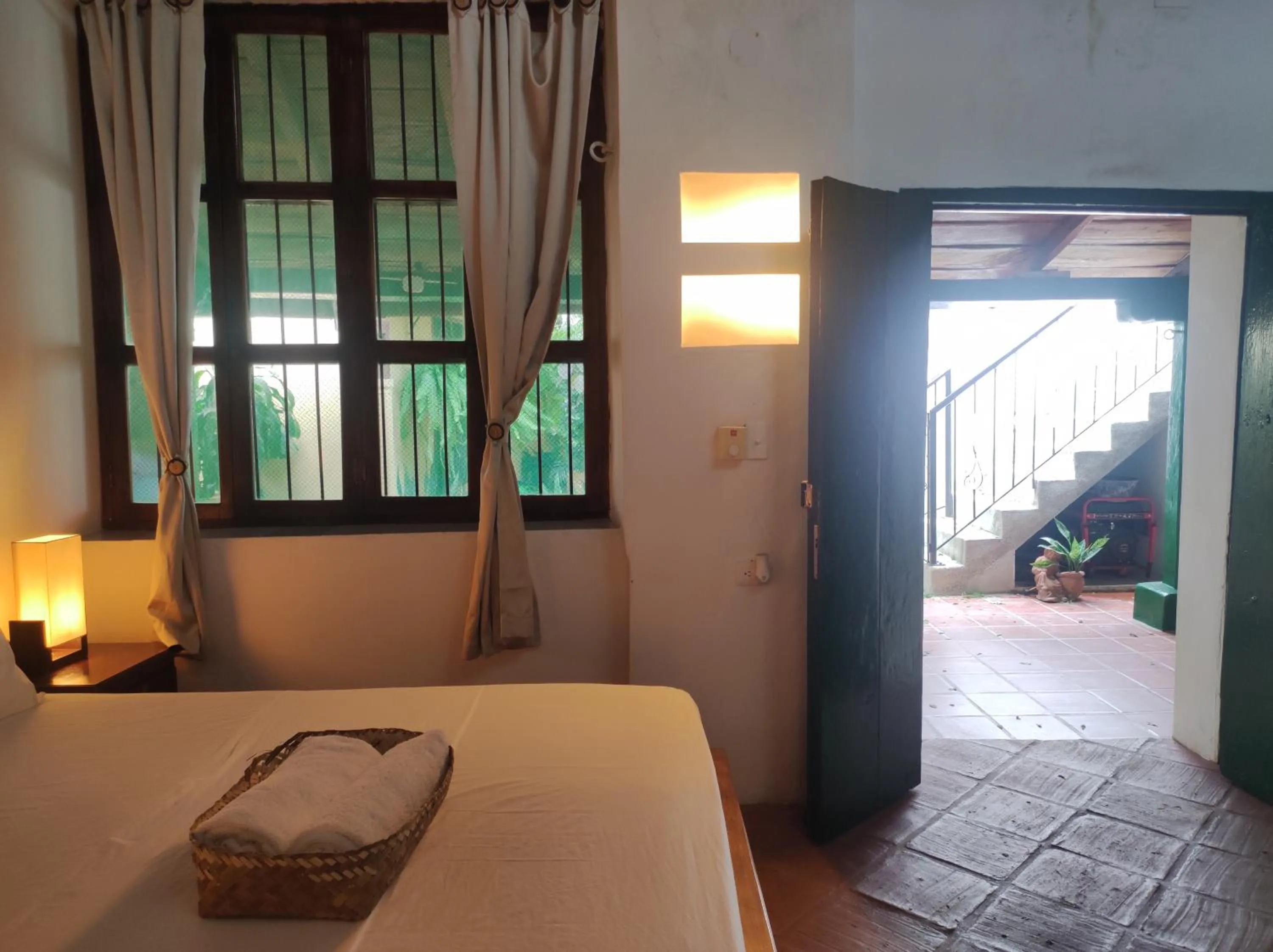 Bed in HOTEL NIETO MOMPOX, ubicado en el corazón del centro histórico, frente al rio magdalena en zona de malecón