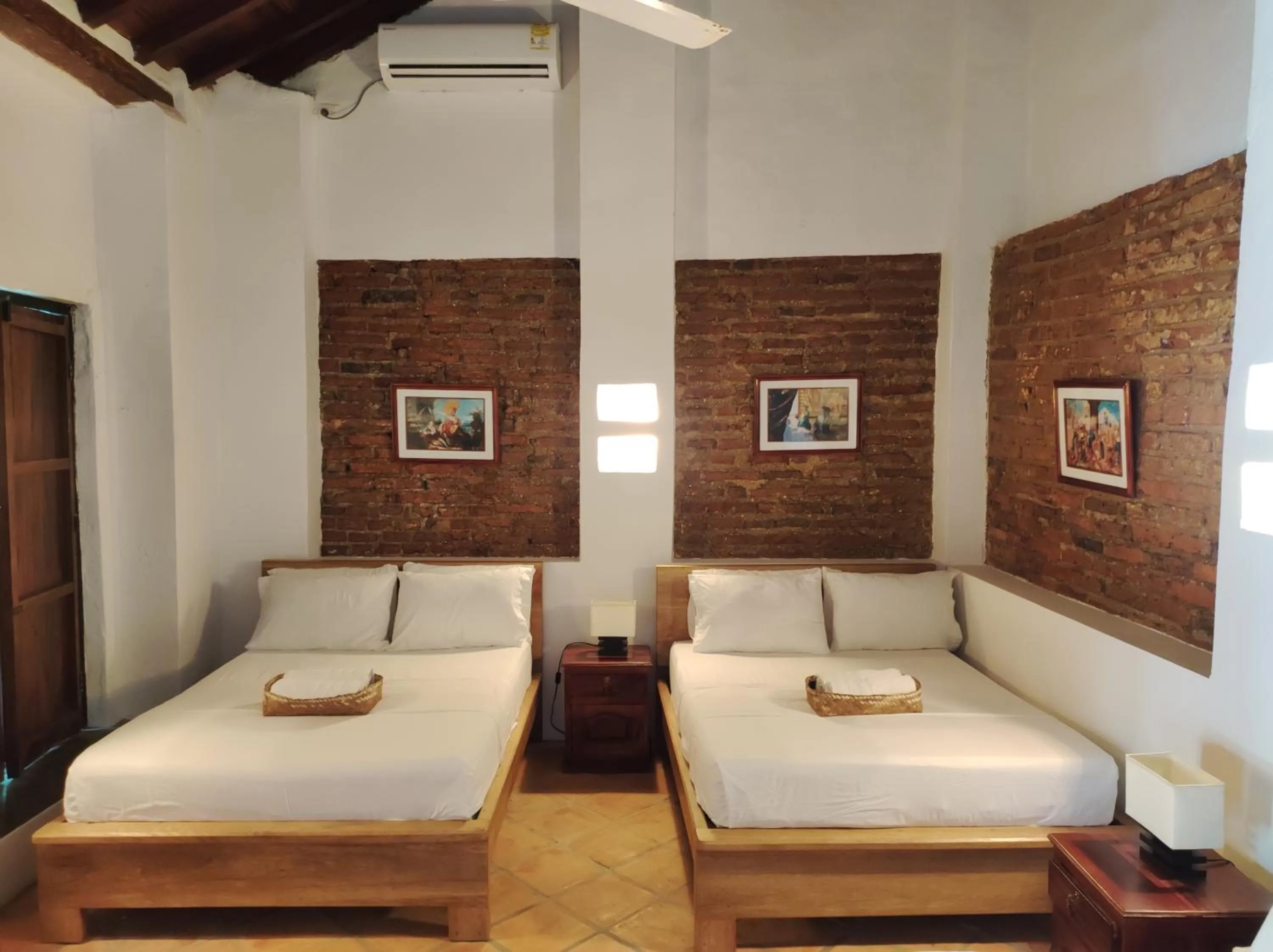 Bed in HOTEL NIETO MOMPOX, ubicado en el corazón del centro histórico, frente al rio magdalena en zona de malecón