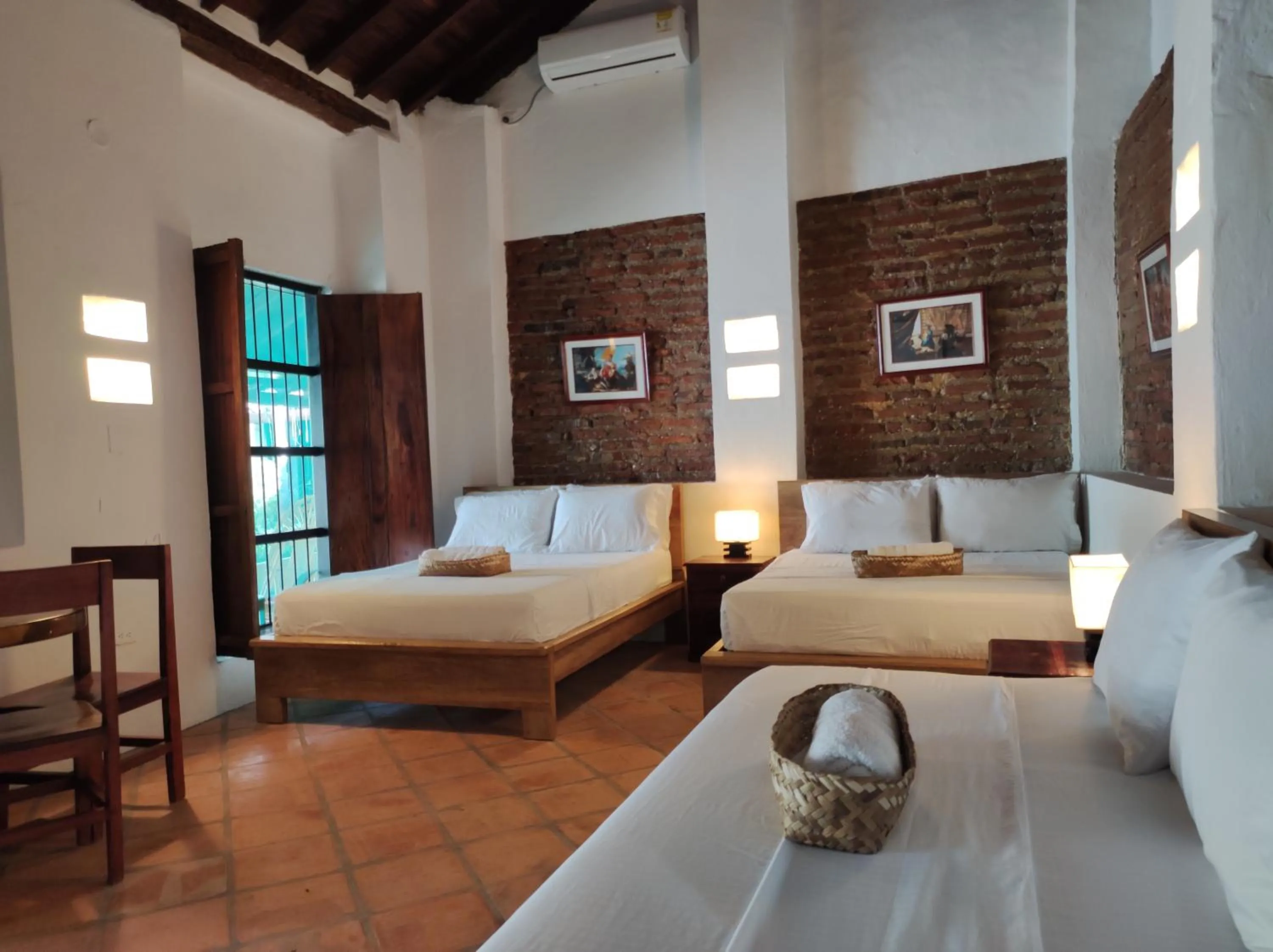 Bed in HOTEL NIETO MOMPOX, ubicado en el corazón del centro histórico, frente al rio magdalena en zona de malecón