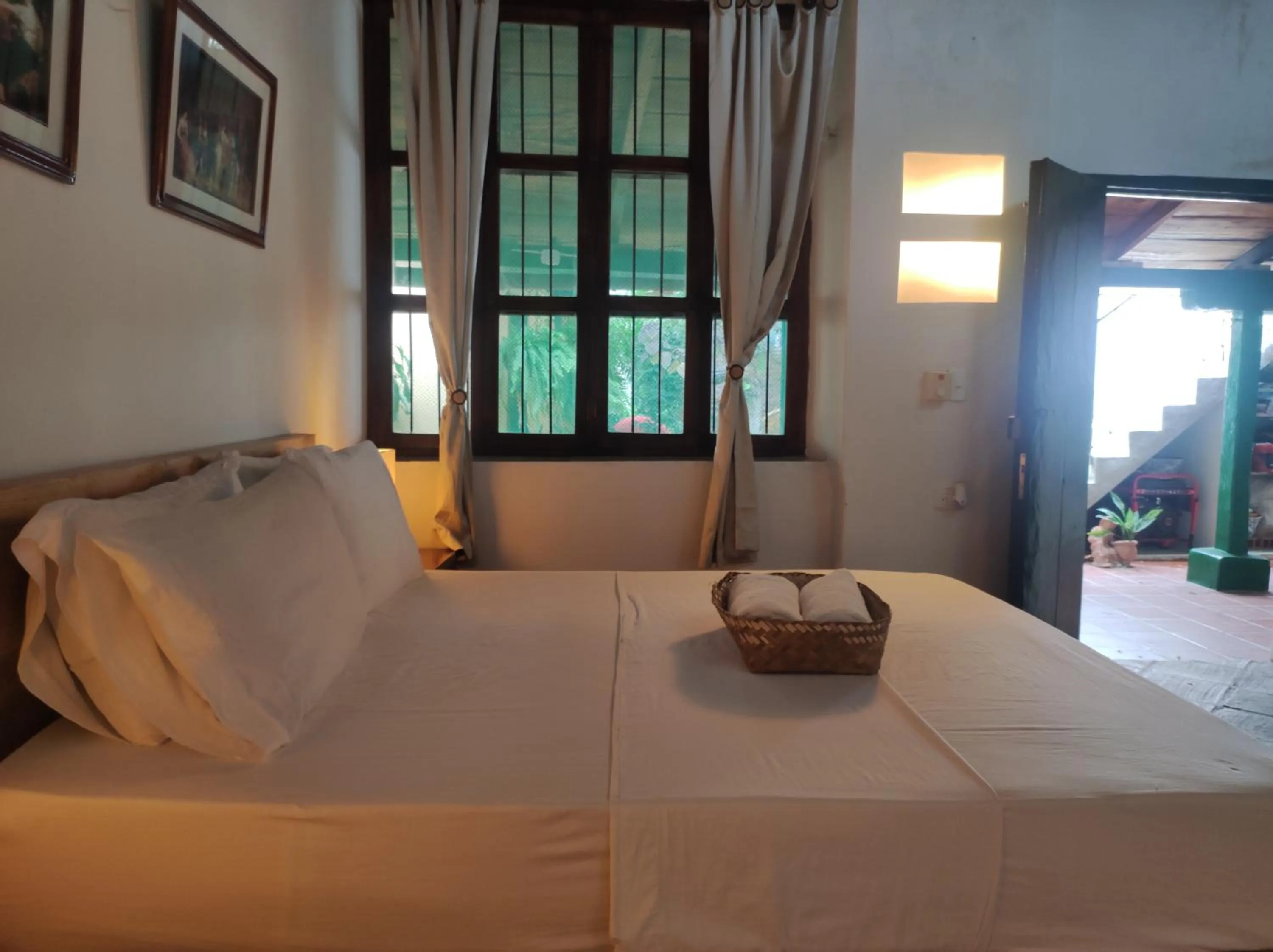 Bed in HOTEL NIETO MOMPOX, ubicado en el corazón del centro histórico, frente al rio magdalena en zona de malecón