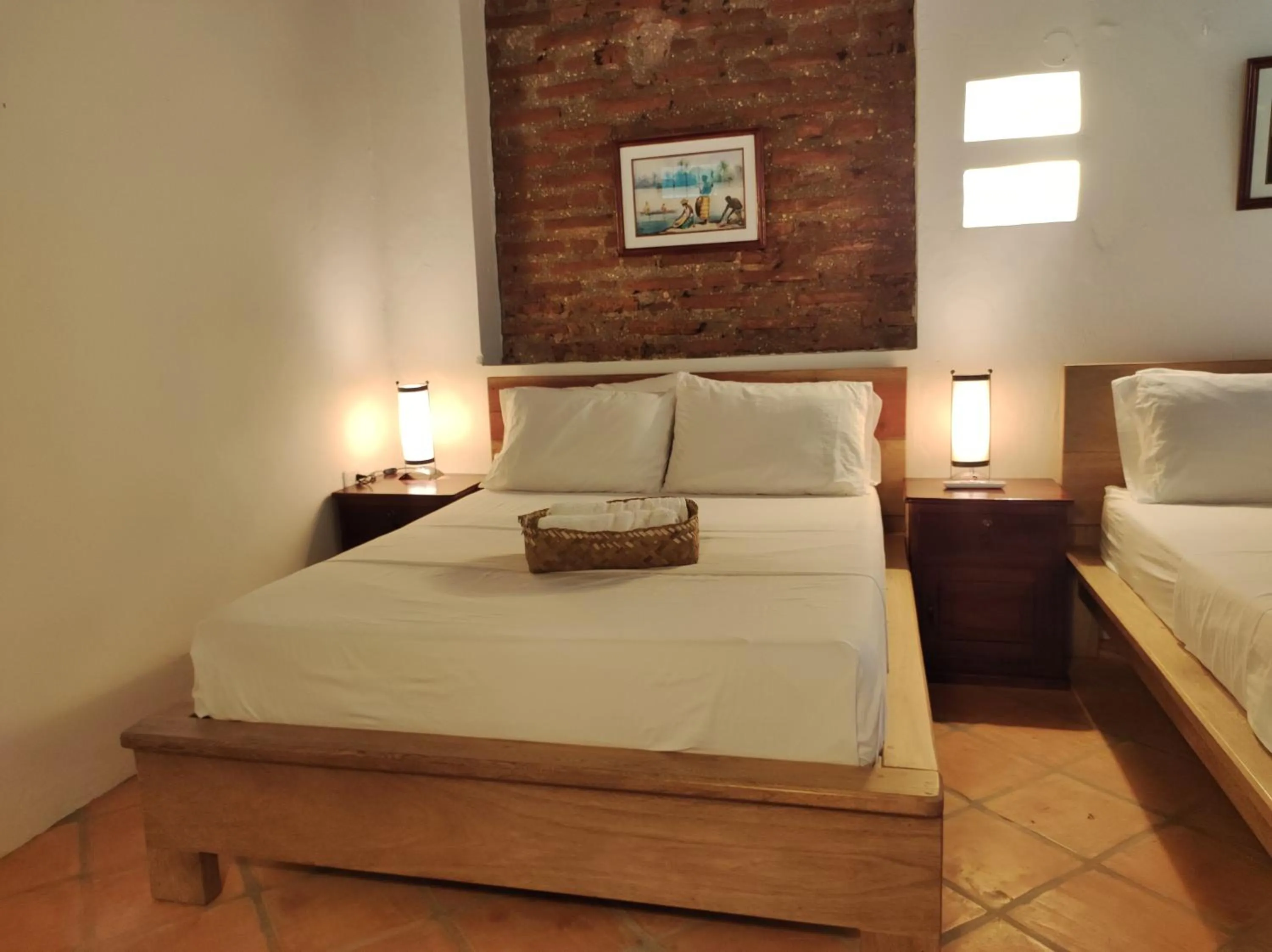 Bed in HOTEL NIETO MOMPOX, ubicado en el corazón del centro histórico, frente al rio magdalena en zona de malecón