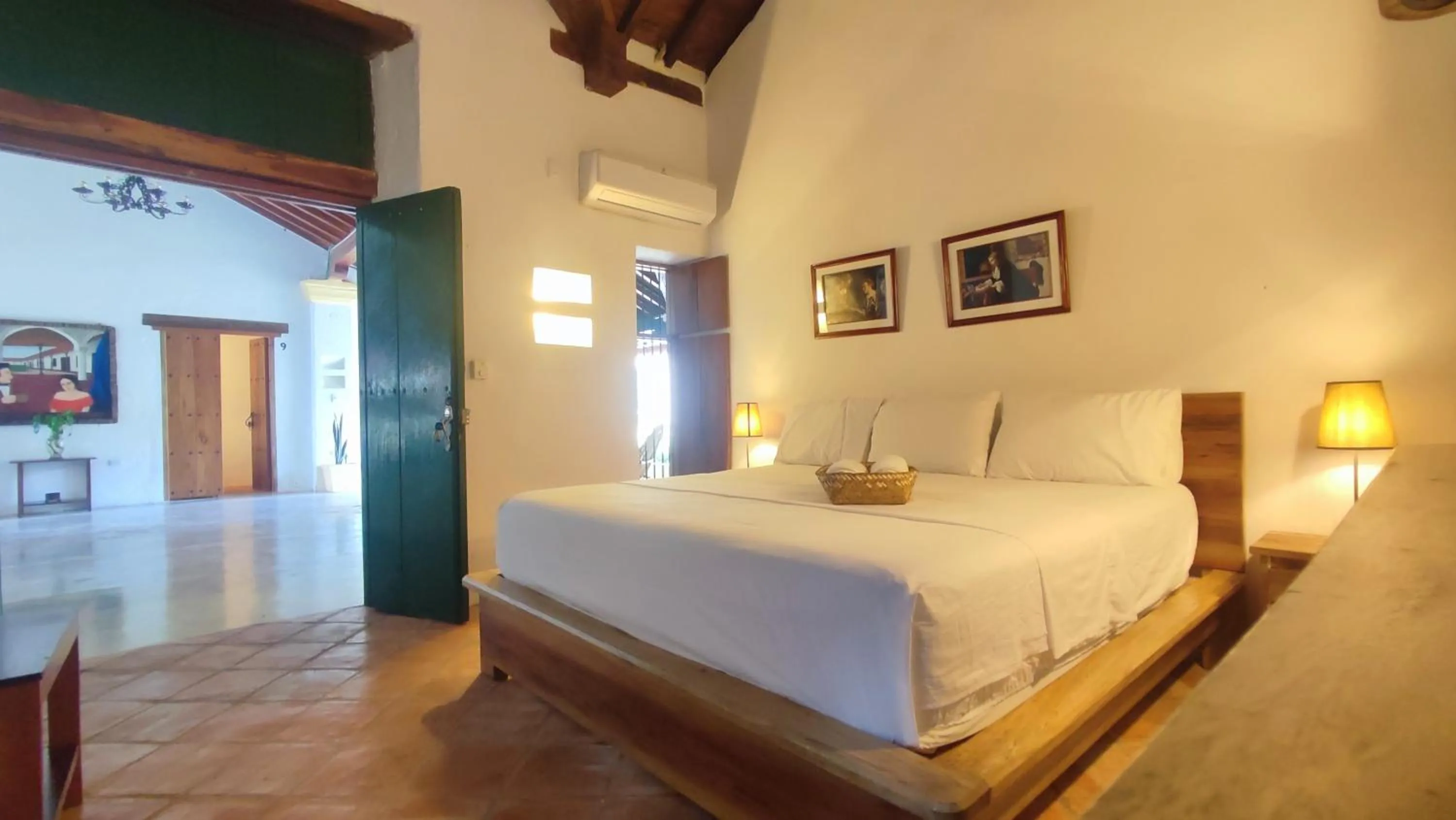 Bed in HOTEL NIETO MOMPOX, ubicado en el corazón del centro histórico, frente al rio magdalena en zona de malecón