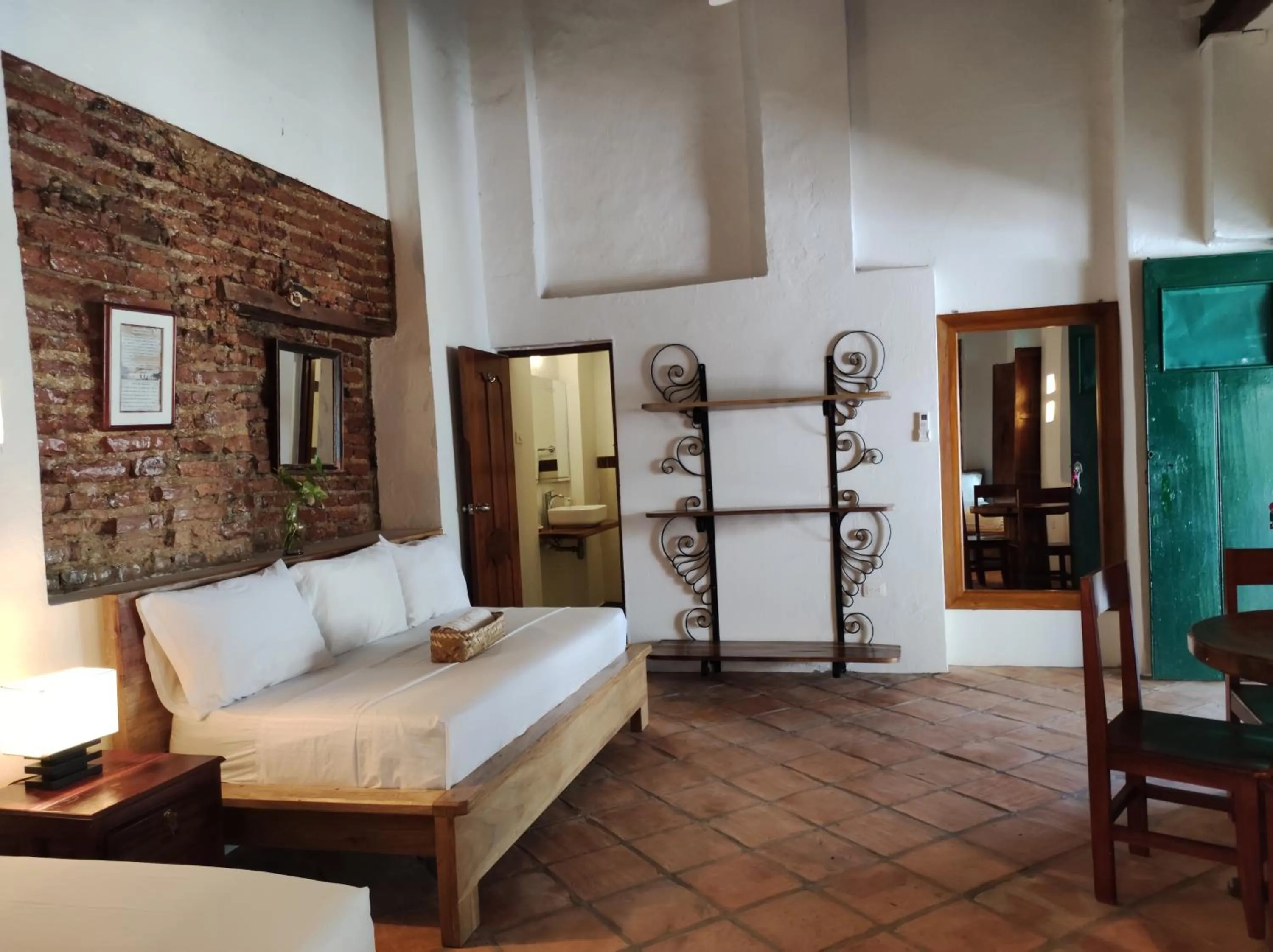 Bed in HOTEL NIETO MOMPOX, ubicado en el corazón del centro histórico, frente al rio magdalena en zona de malecón