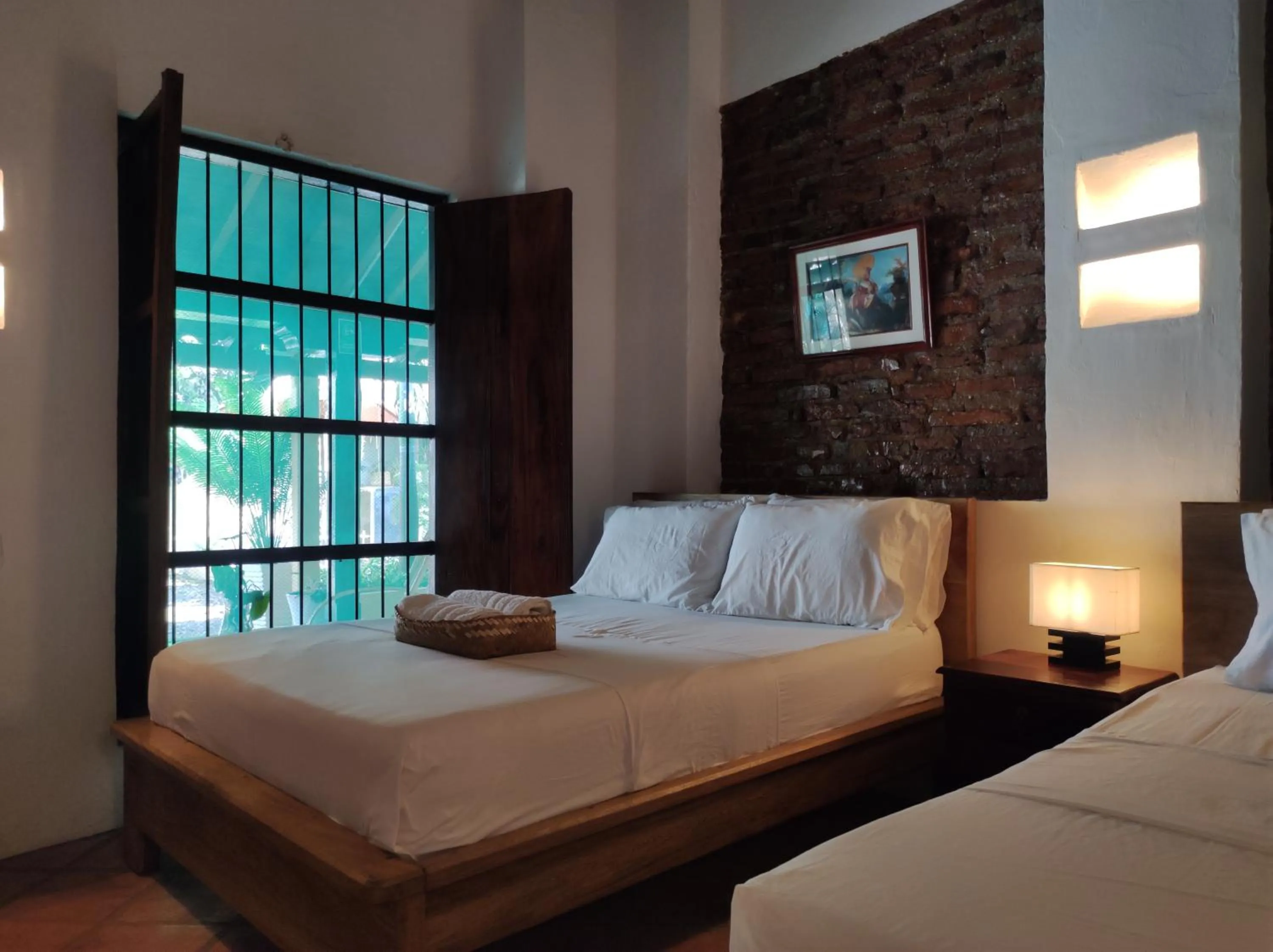 Bed in HOTEL NIETO MOMPOX, ubicado en el corazón del centro histórico, frente al rio magdalena en zona de malecón