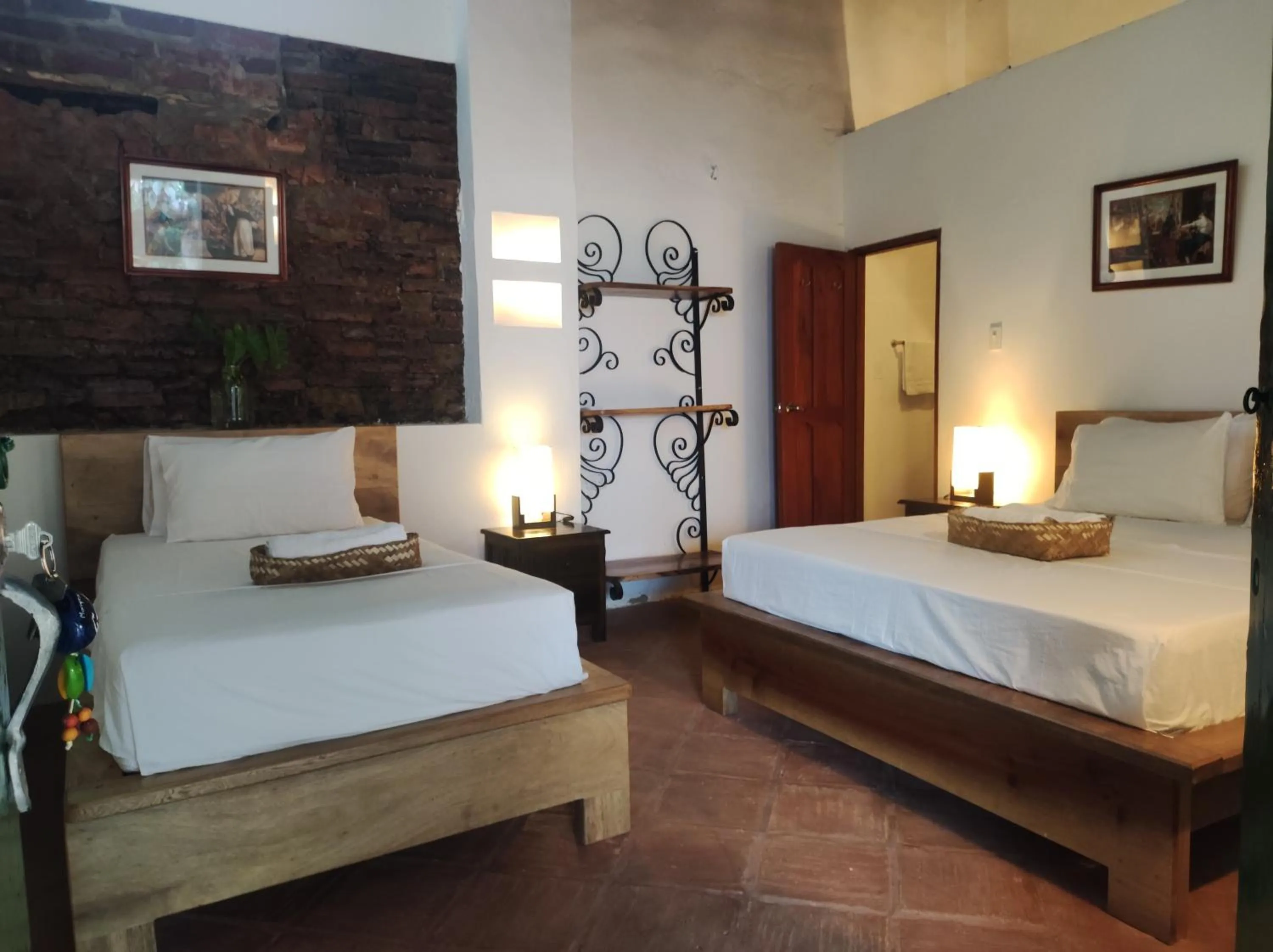 Bed in HOTEL NIETO MOMPOX, ubicado en el corazón del centro histórico, frente al rio magdalena en zona de malecón