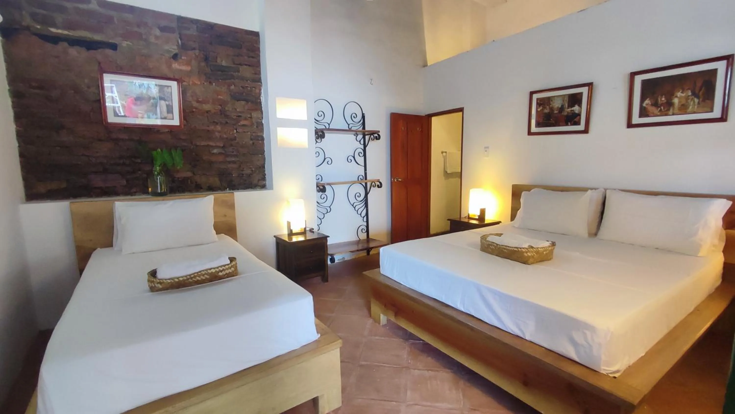 Bed in HOTEL NIETO MOMPOX, ubicado en el corazón del centro histórico, frente al rio magdalena en zona de malecón