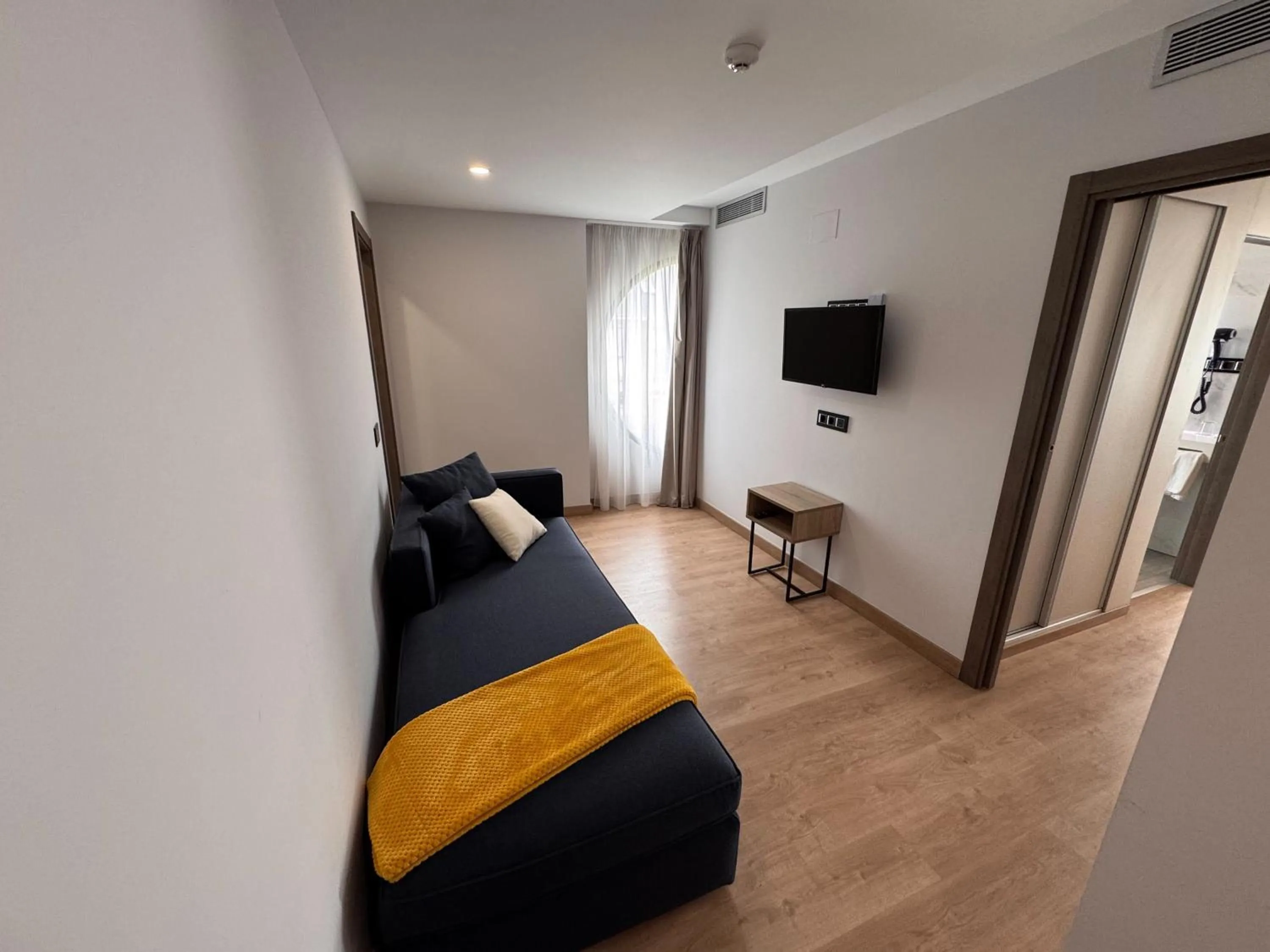 Photo of the whole room, Bed in Playa de Foz Hotel & Spa by gaiarooms