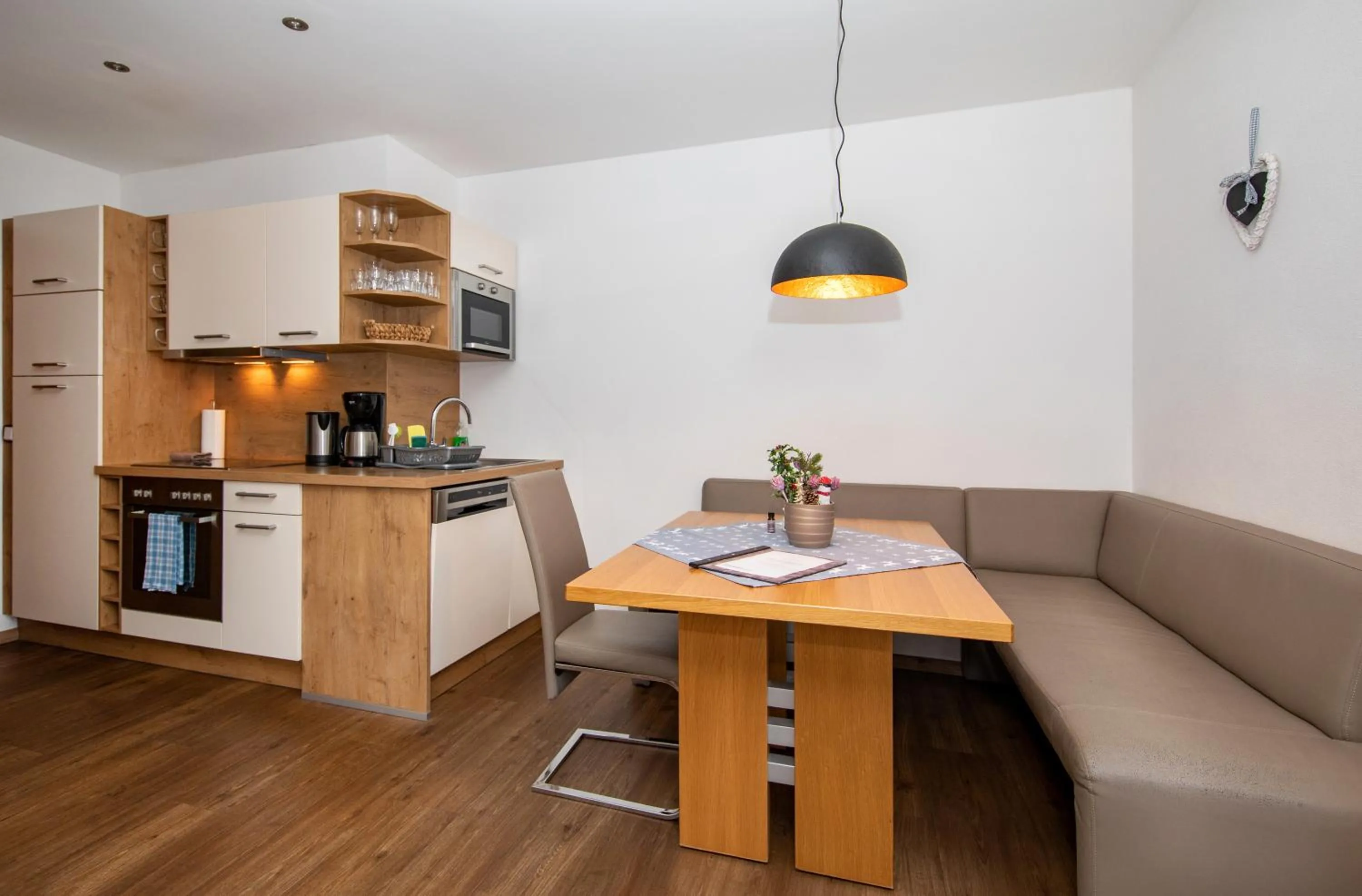 Kitchen or kitchenette in Appartement Living Schönwies apartments with private Infrared cabin and Zell am See Kaprun summercard