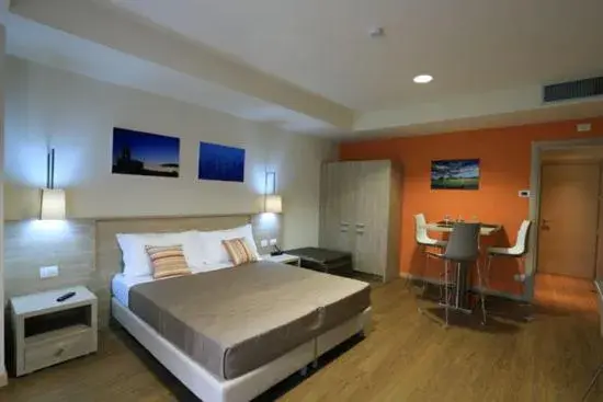 Photo of the whole room, Bed in Turin Airport Hotel & Residence Photo of the whole room, Bed in Turin Airport Hotel & Residence