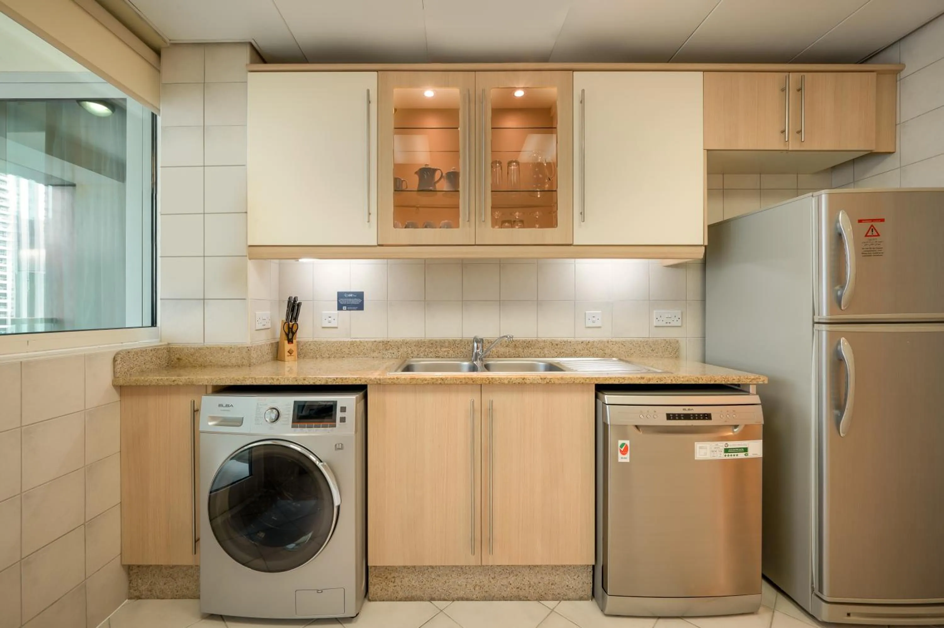 Kitchen or kitchenette in Oaks Liwa Heights Hotel Suites