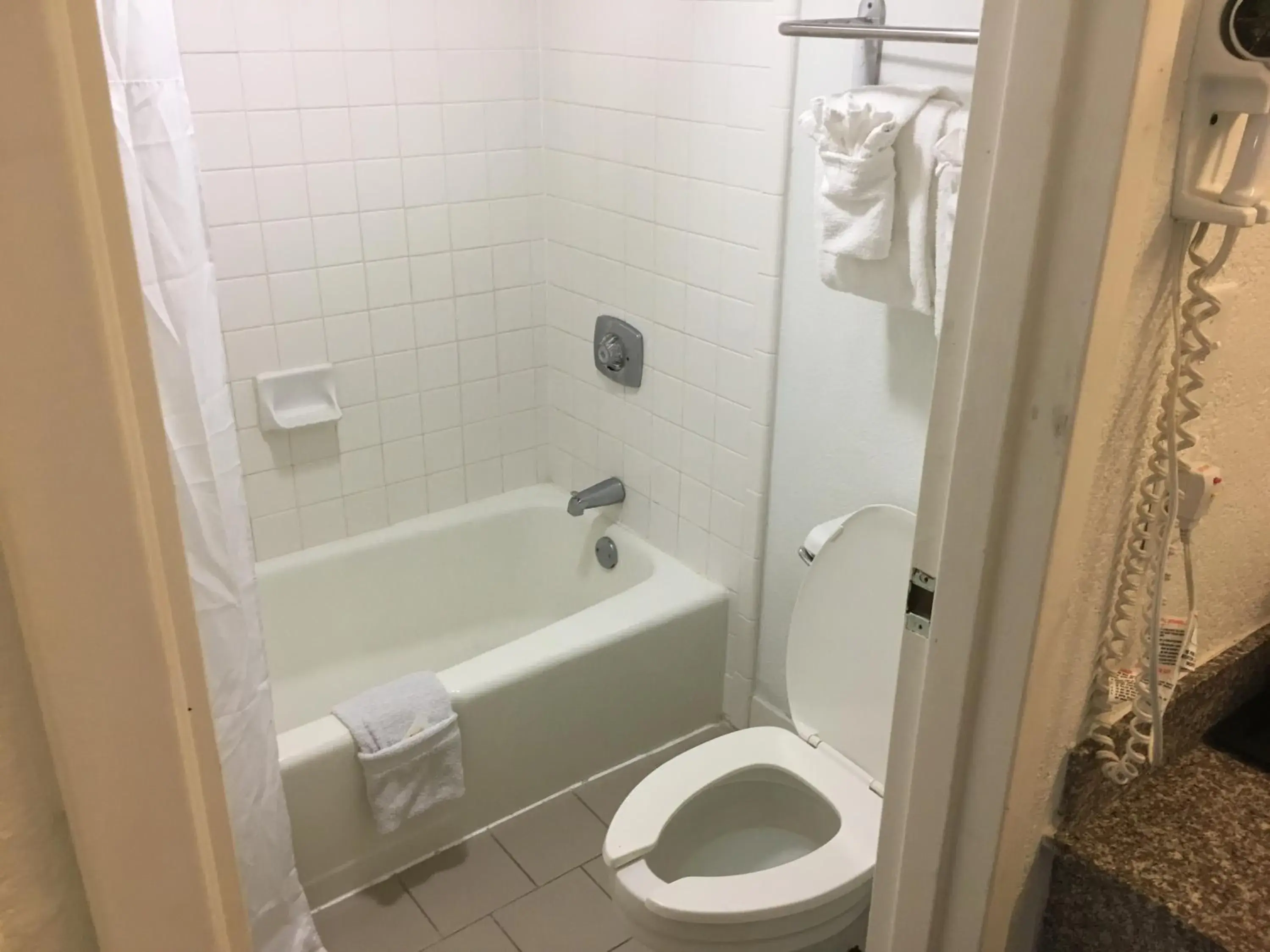 towels, Bathroom in Days Inn & Suites Mobile