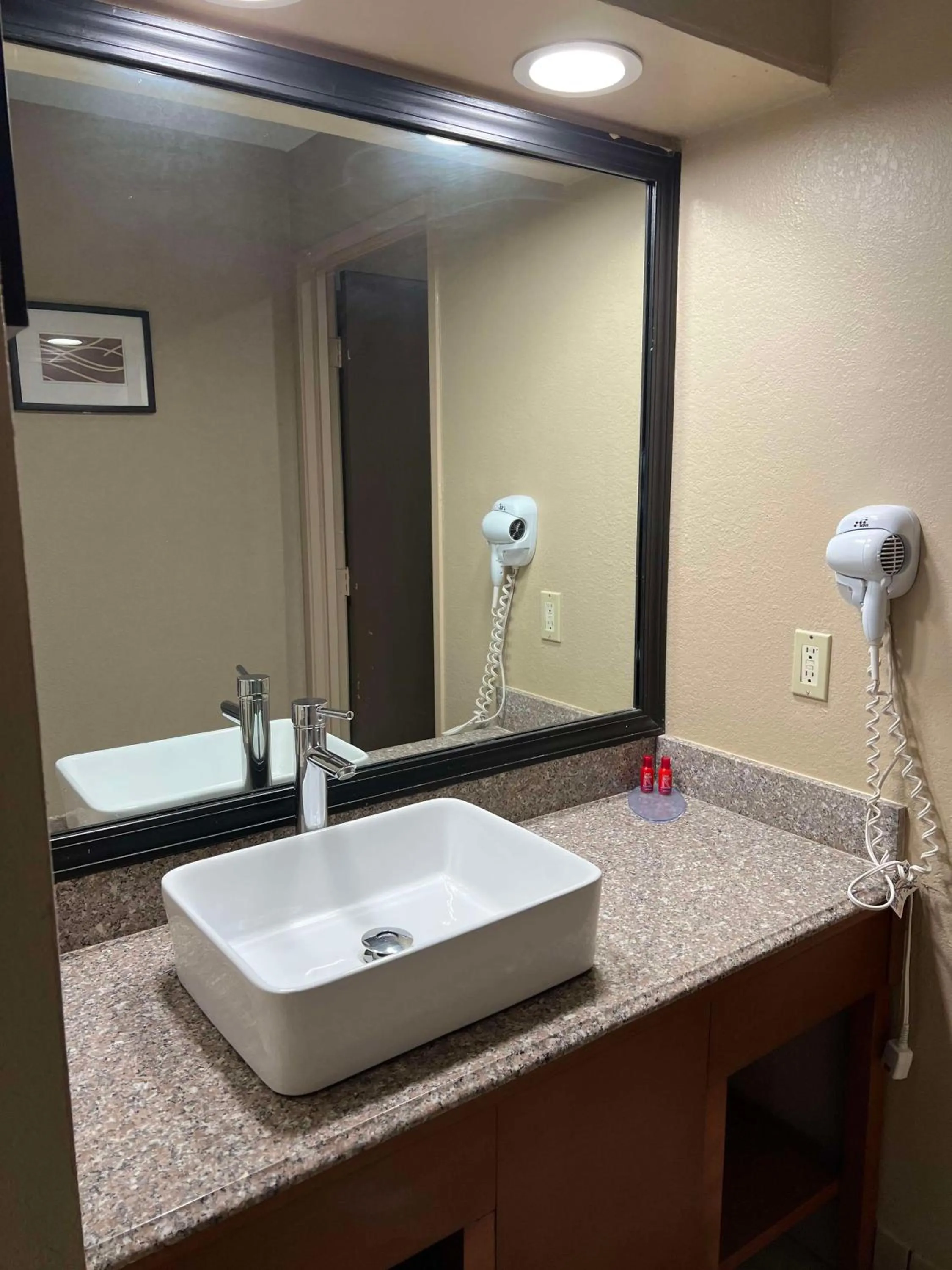 Bathroom in SureStay Plus by Best Western Mobile I-65