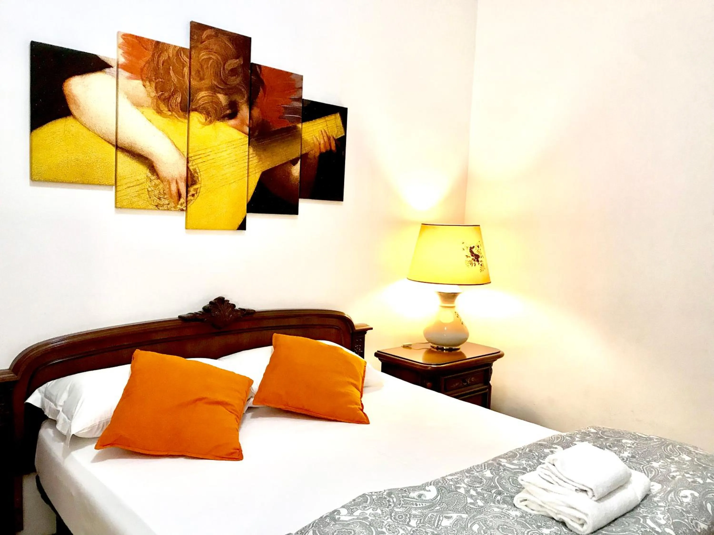 Bed in COLOSSEUM LUXURY ROOM