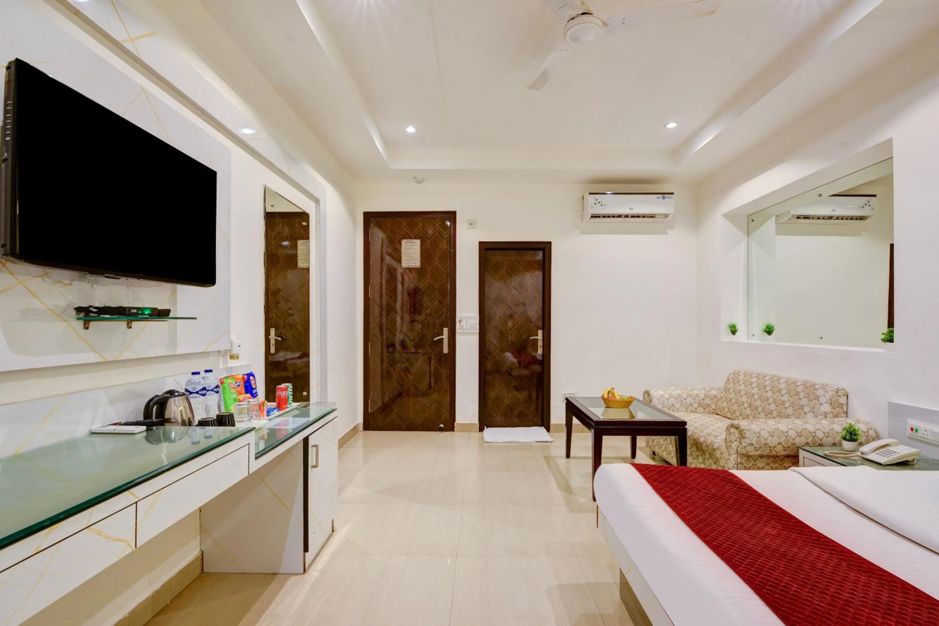 Communal lounge/ TV room, Bed in Hotel Krishna Deluxe-By RCG Hotels