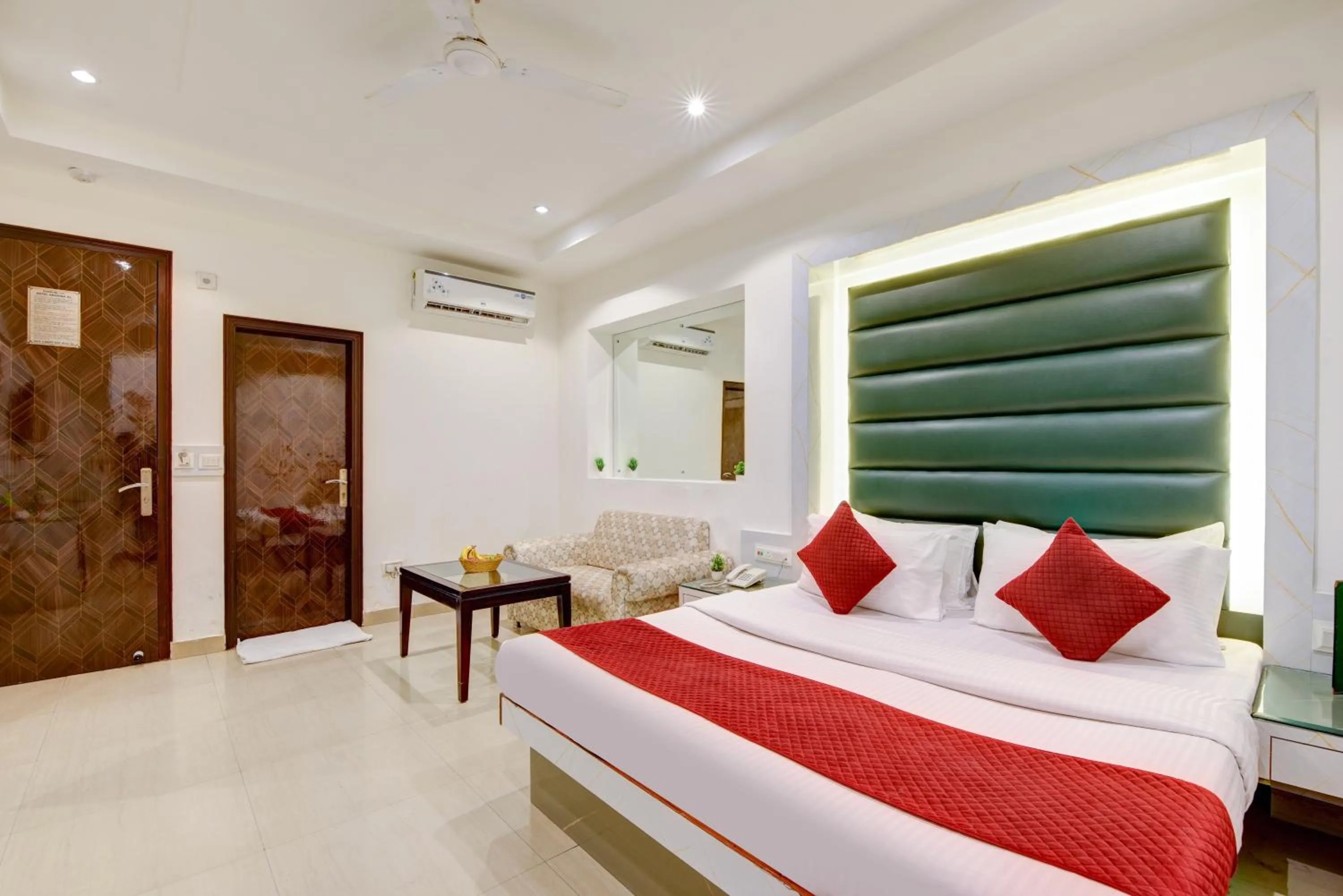 Seating area, Bed in Hotel Krishna Deluxe-By RCG Hotels