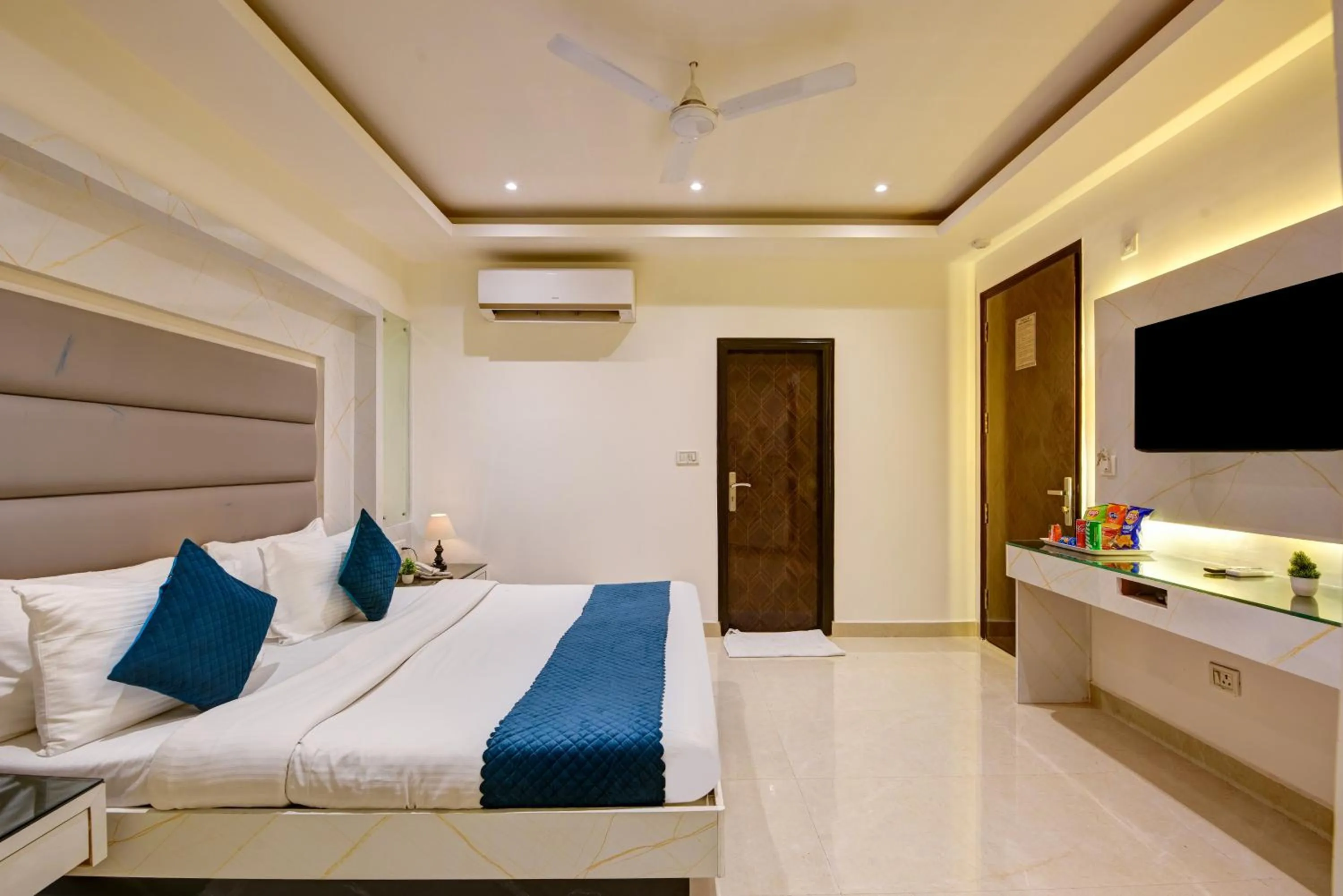 Communal lounge/ TV room, Bed in Hotel Krishna Deluxe-By RCG Hotels