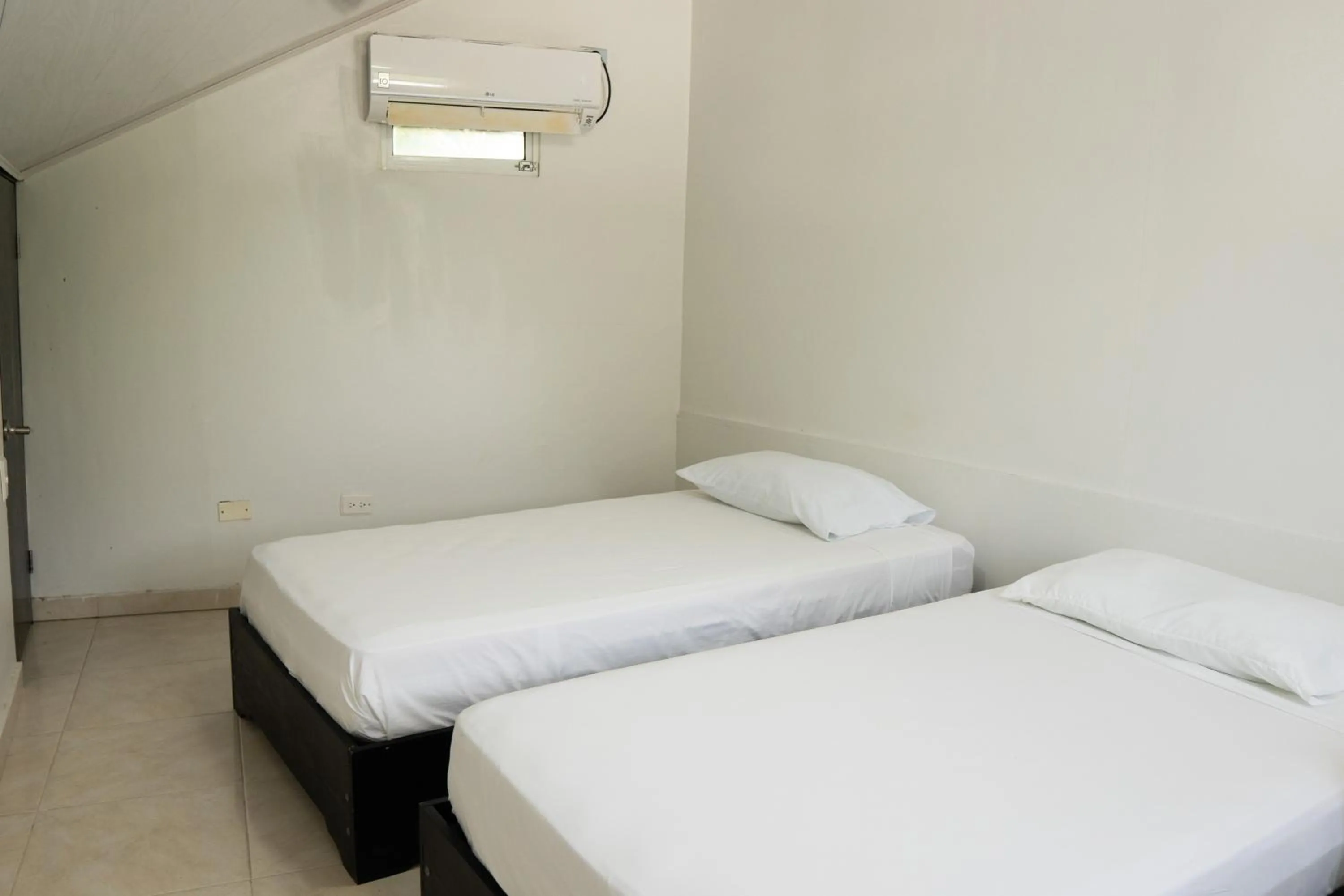 Bed in Rocky Cay Lodging