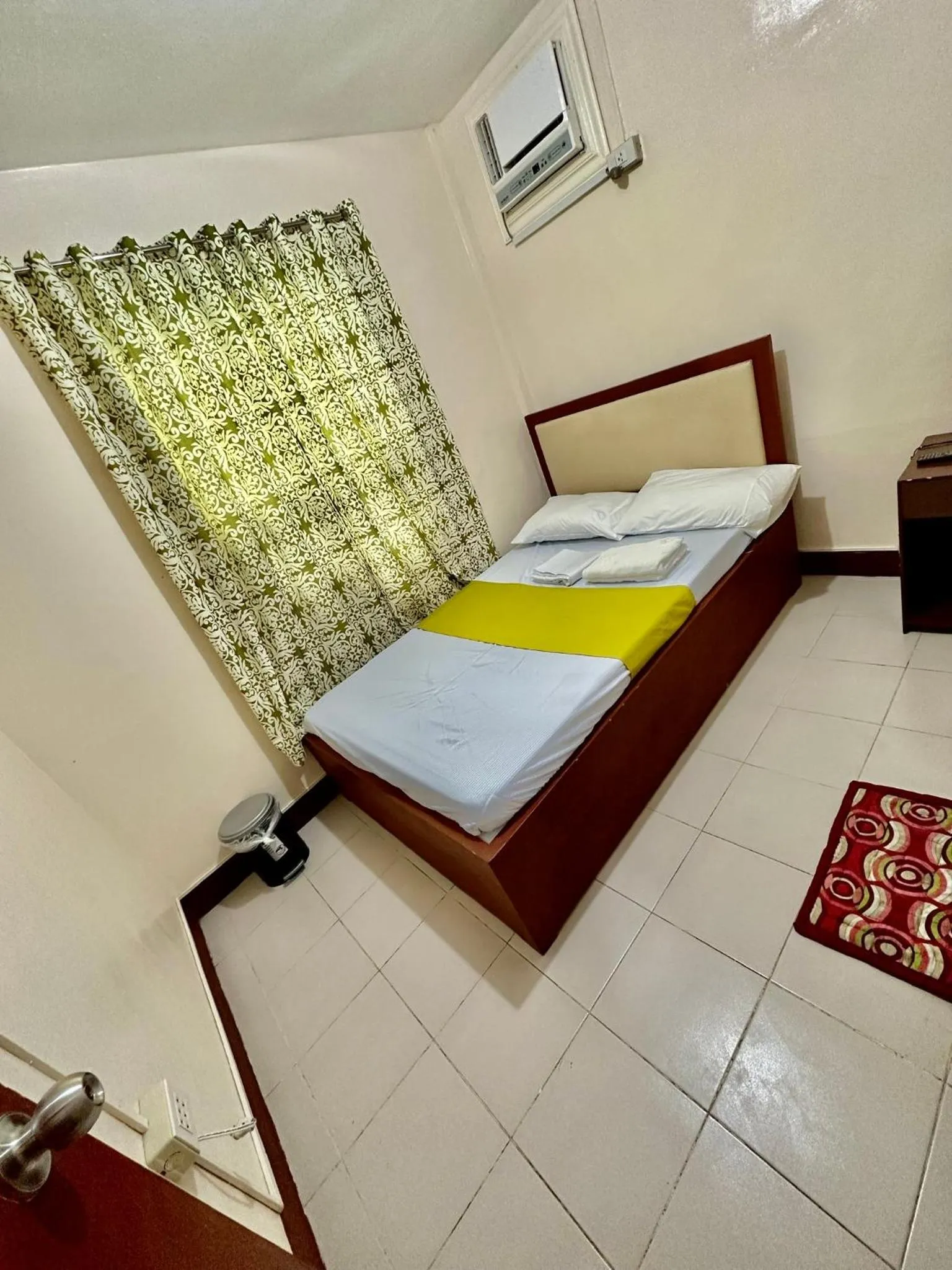 Photo of the whole room, Bed in Wendy's Apartelle