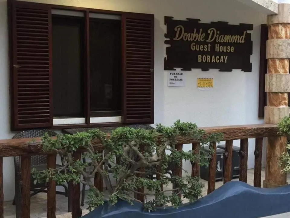 Property logo or sign in Double Diamond Inn Guest House