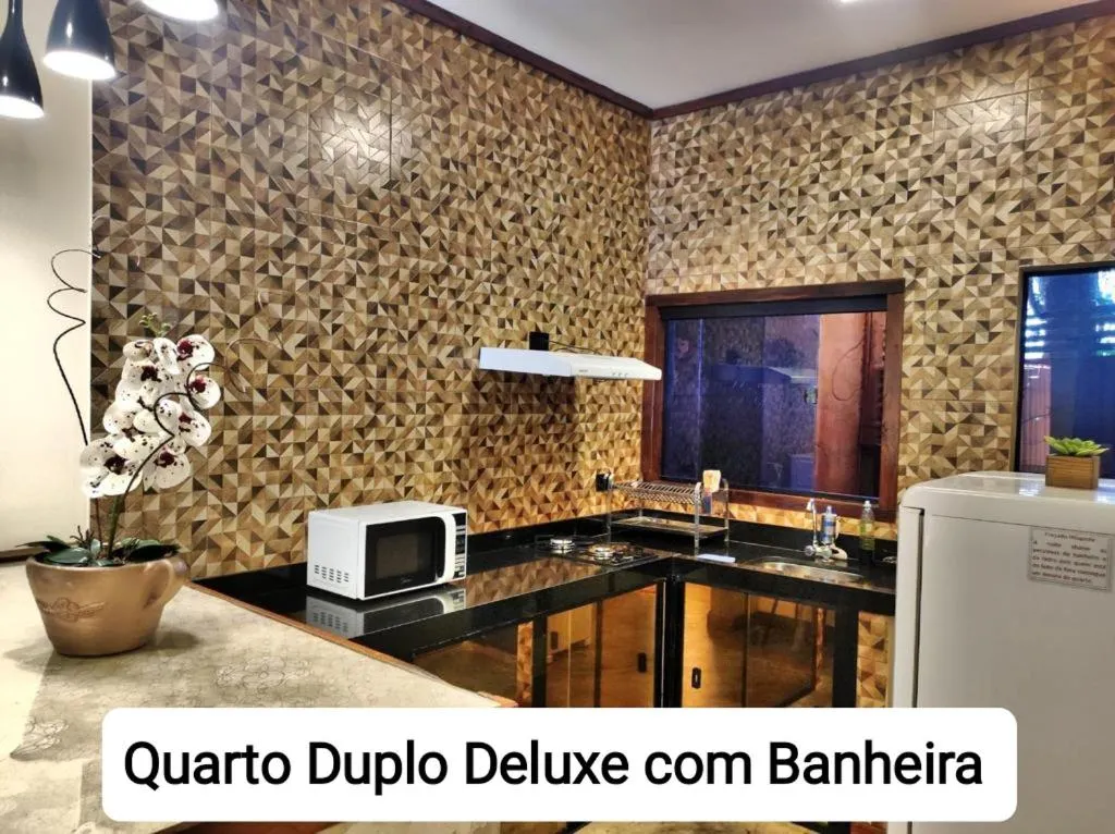 Kitchen or kitchenette in Sanctuary Pirenópolis Suítes e Flats