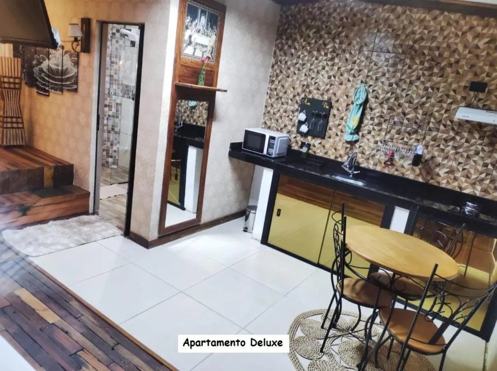 Kitchen or kitchenette in Sanctuary Pirenópolis Suítes e Flats