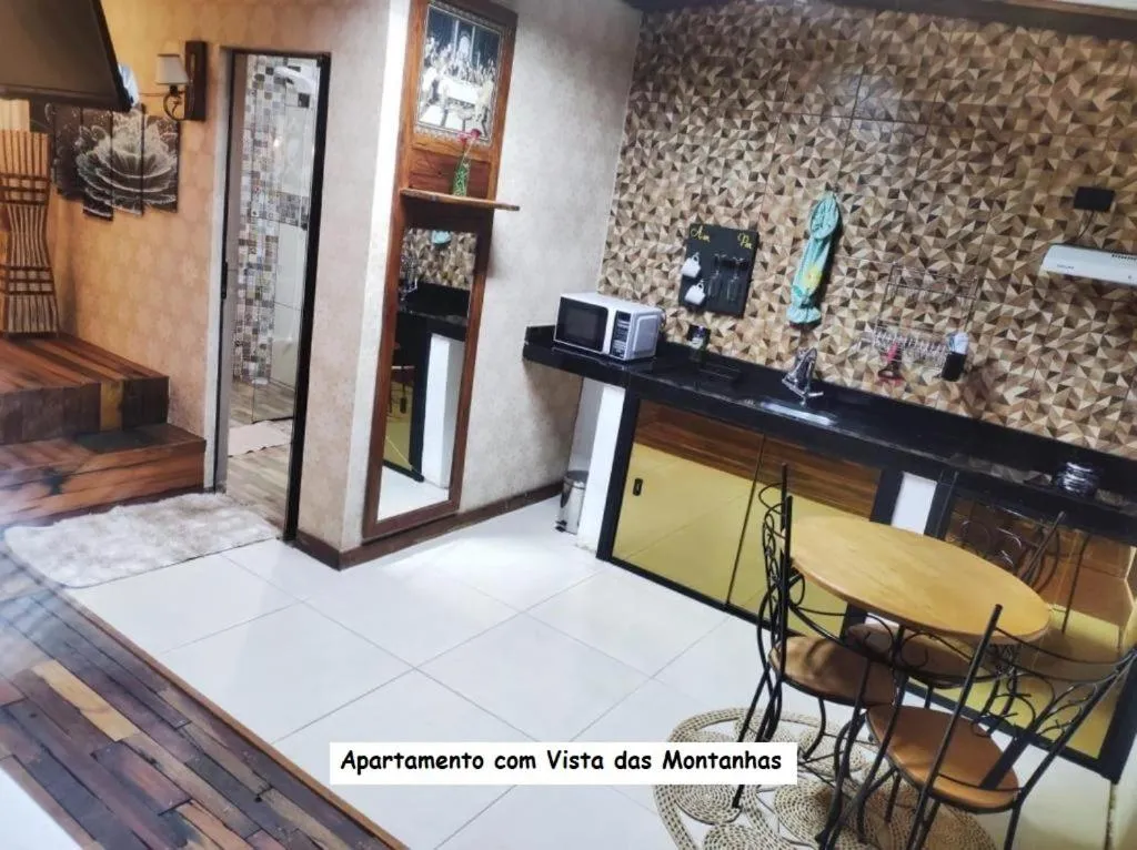 Kitchen or kitchenette in Sanctuary Pirenópolis Suítes e Flats