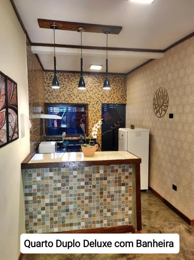 Kitchen or kitchenette in Sanctuary Pirenópolis Suítes e Flats