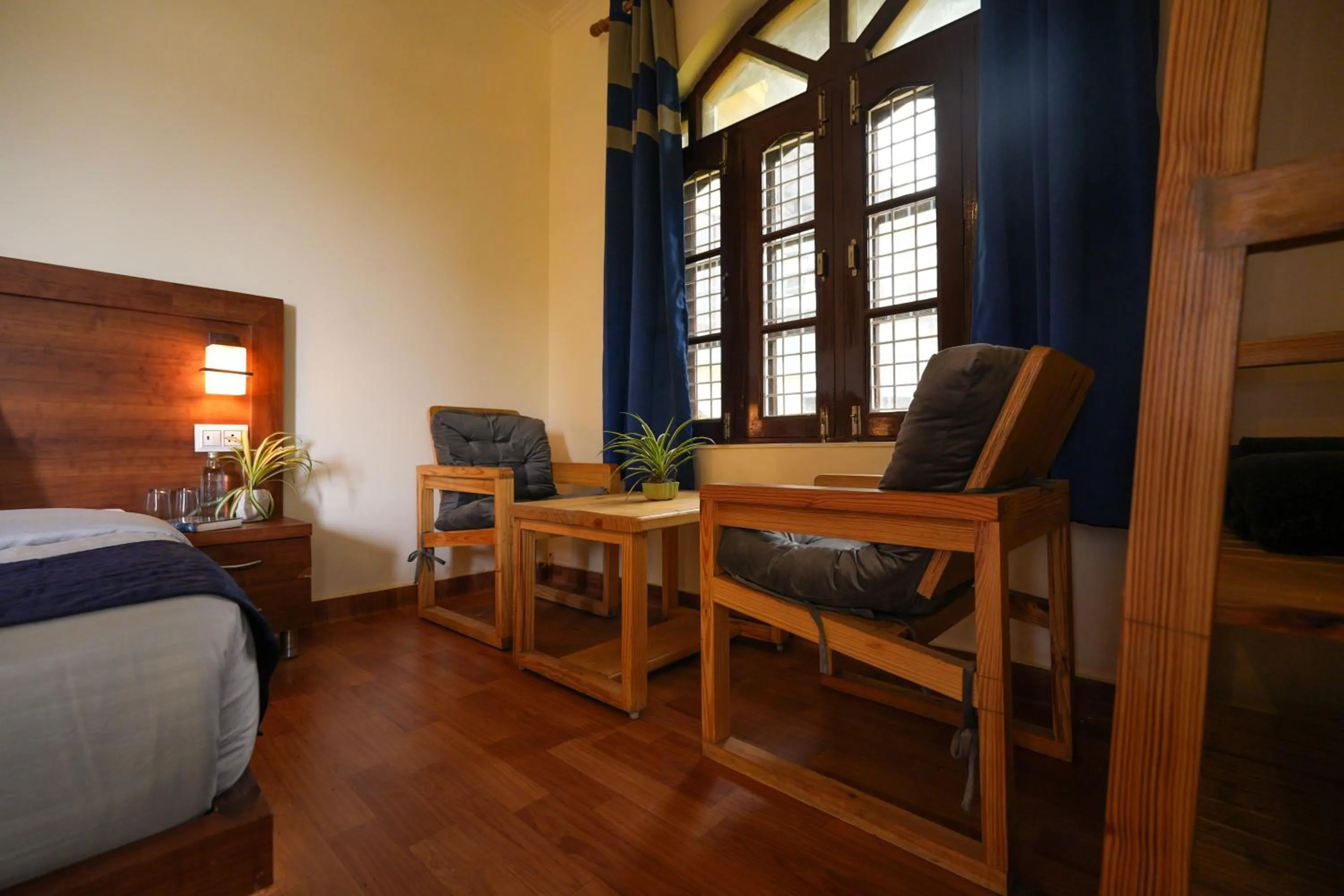 Seating area, Bed in Shalom Backpackers Rishikesh